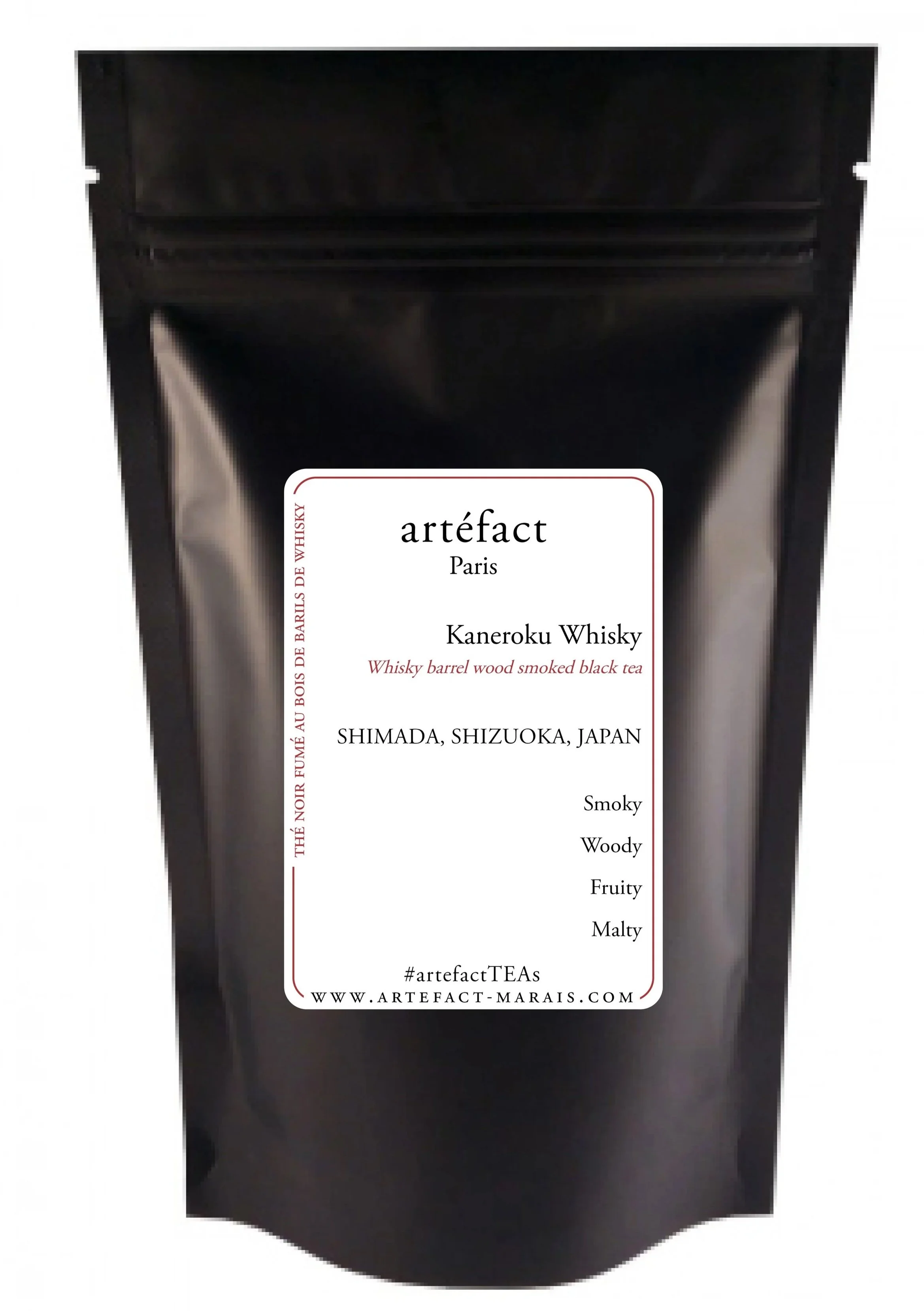 Black package of Artefact Kaneroku Whisky with a white label, listing flavor profiles including Smoky, Woody, Fruity, Malty, and others, from Shimada, Shizuoka, Japan.