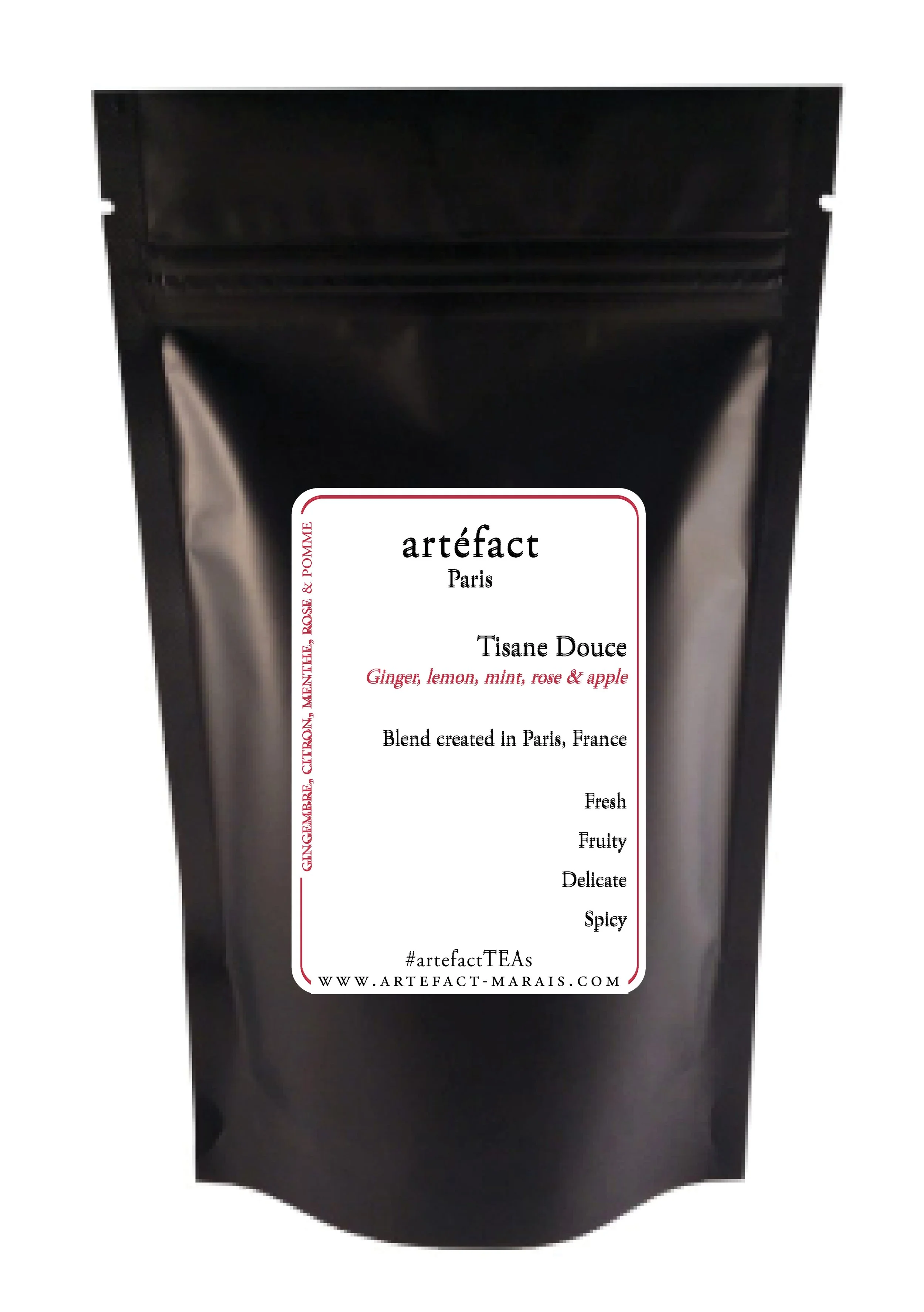 Black tea packaging with a white label that reads 'artefact Paris Tisane Douce' and lists flavors including ginger, lemon, mint, rose, and apple, with additional description of the tea's qualities in black text.