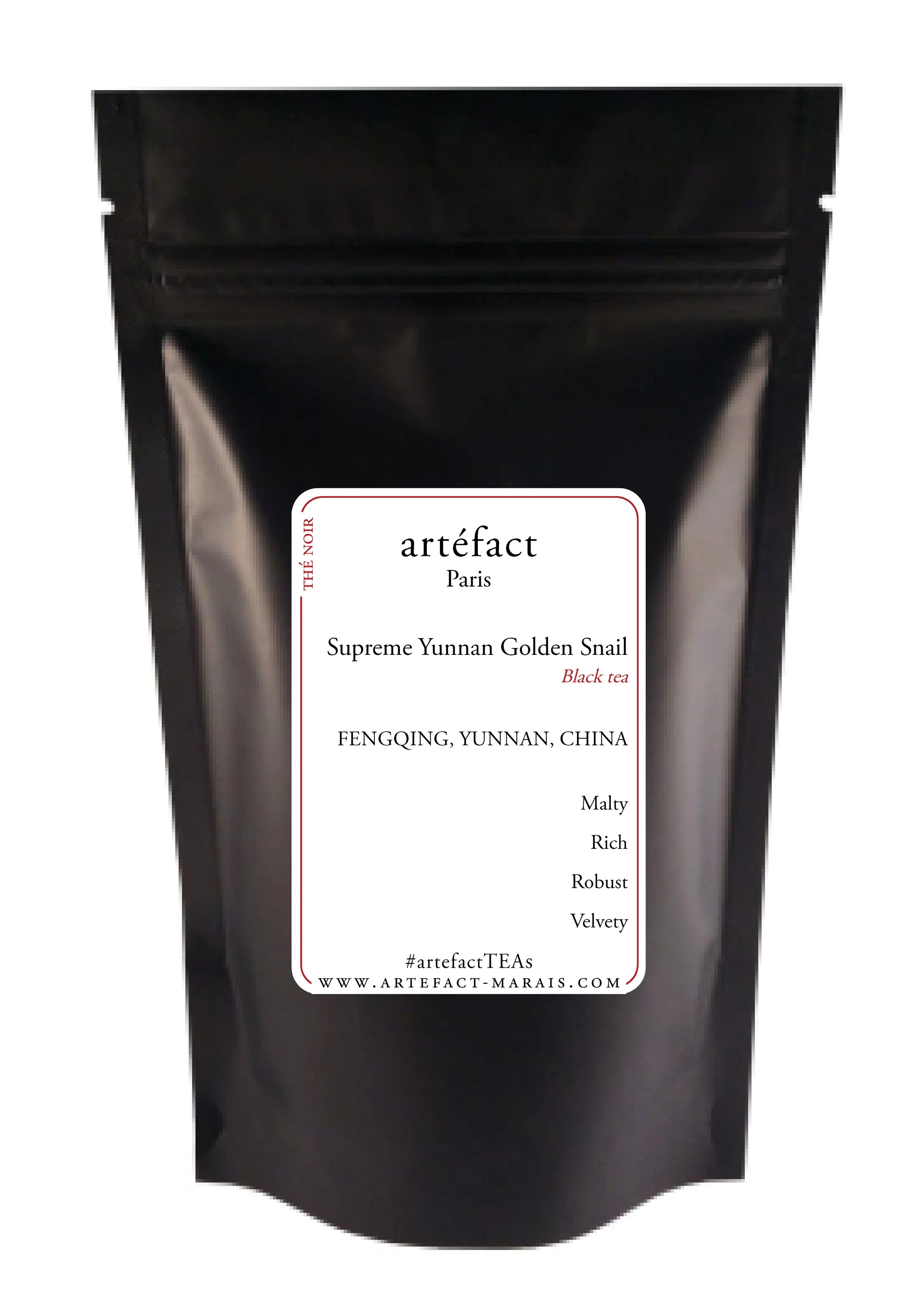 Package of Artefact tea with a black background and white label listing various tea flavors and details about the product.