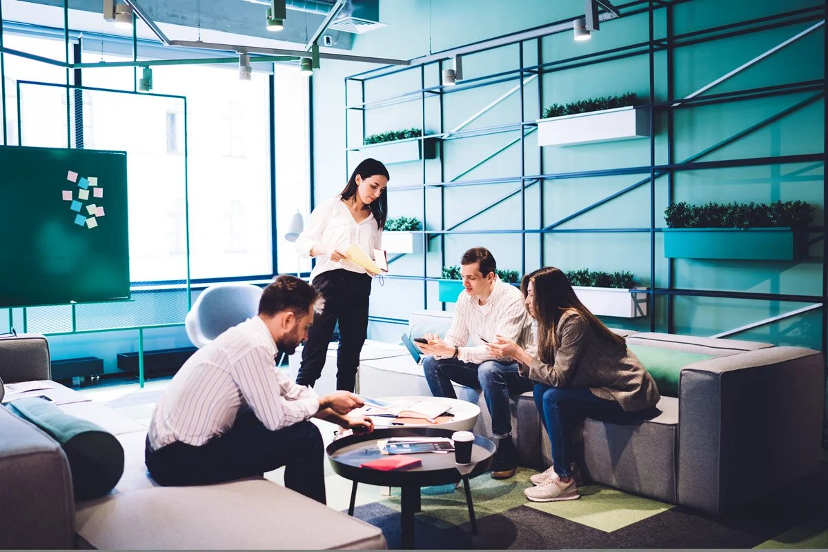 Coworkers having a culture conversation in a modern workplace