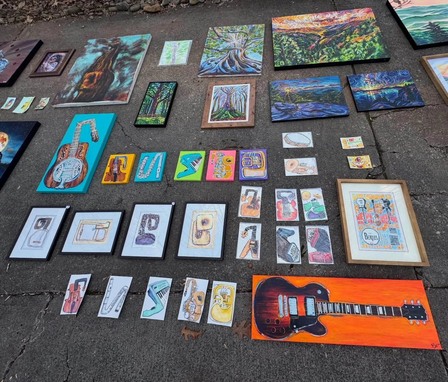 Enjoy some views of my impromptu driveway show. I had been resisting the impulse to lay my collections out to review for weeks and am so happy I finally gave in. Now that I&rsquo;m testing out multi instrument larger acrylic paintings, I feel like th