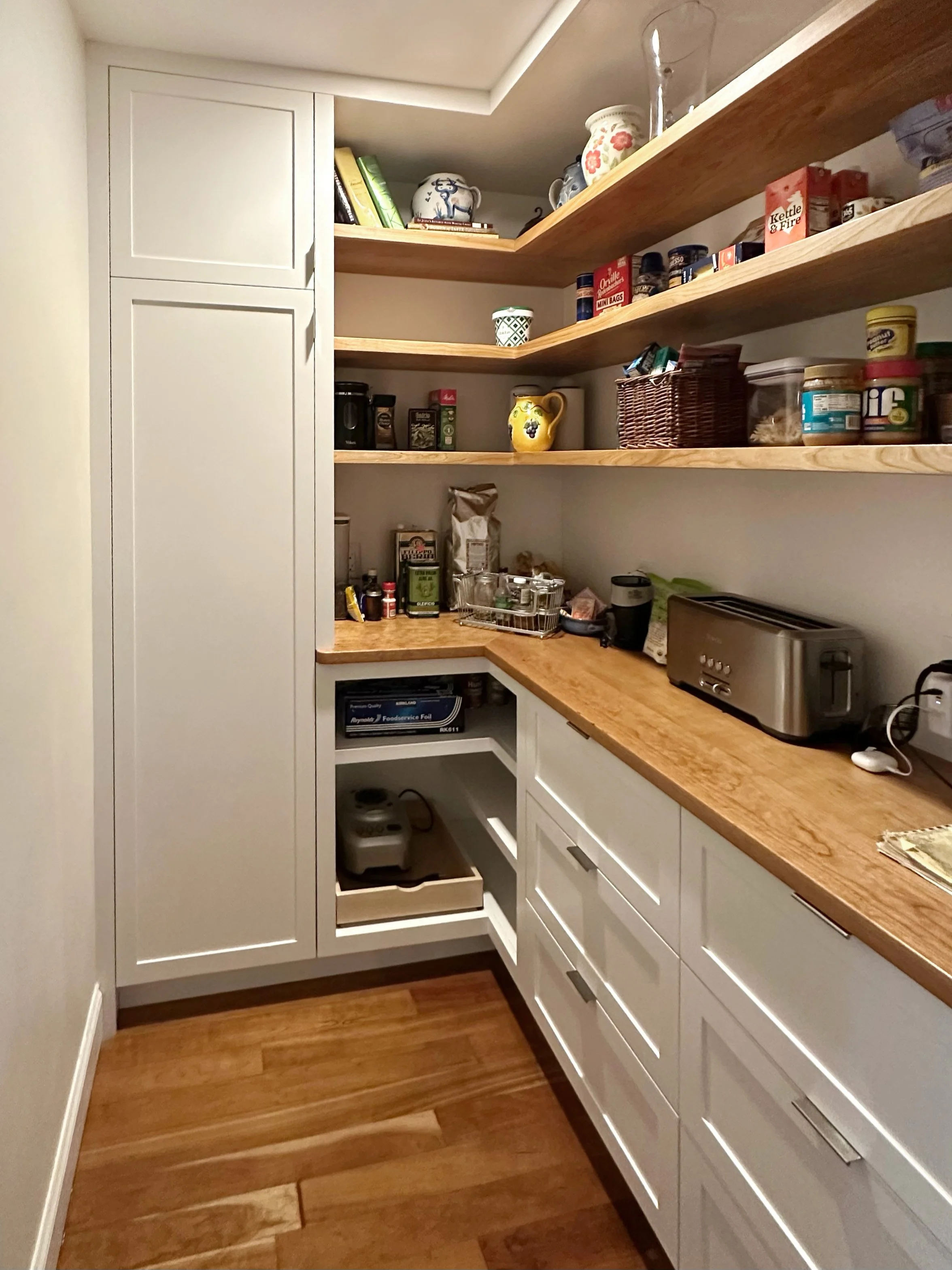 Custom pantry cabinetry with handcrafted storage and open shelving in Newburyport, Massachusetts.