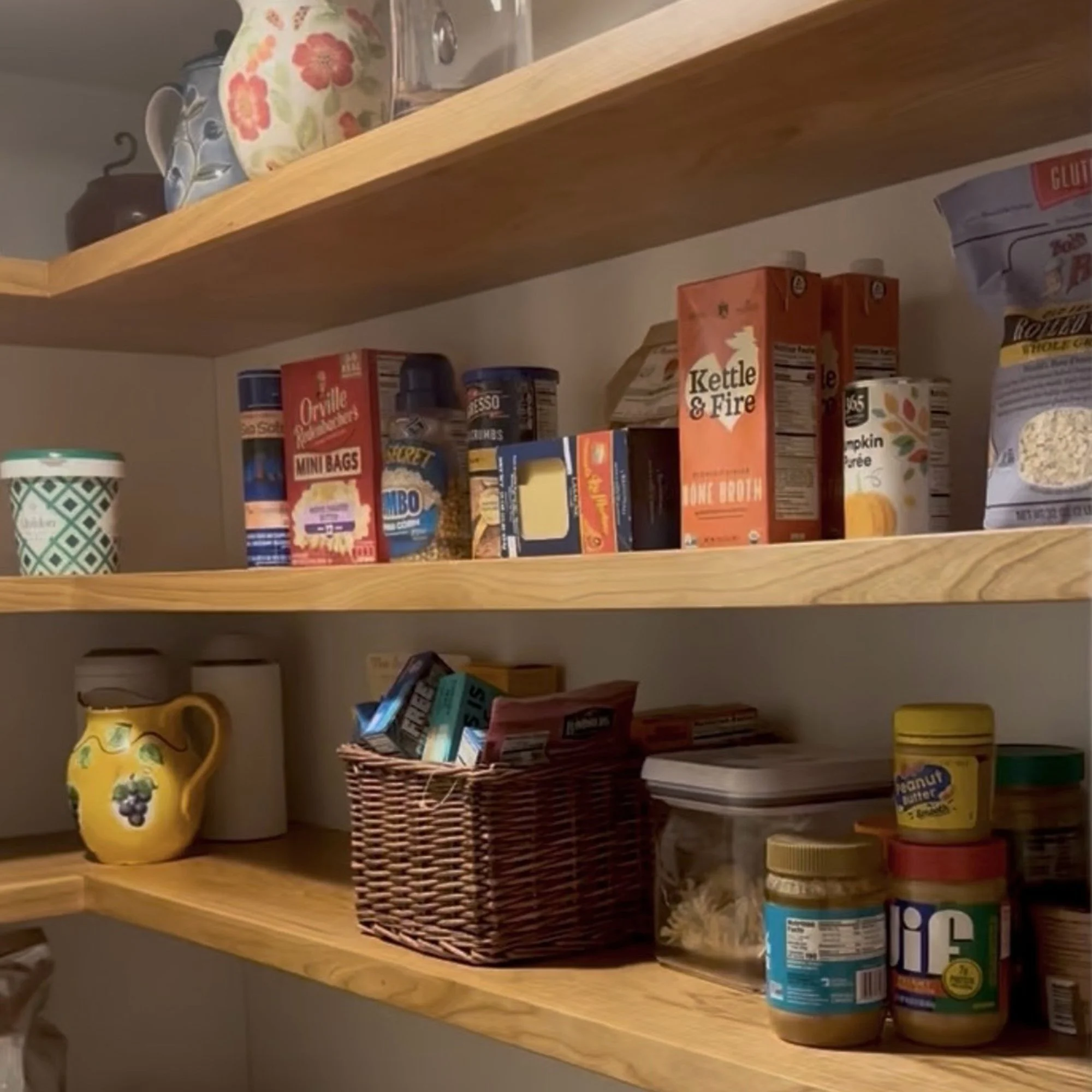 Detail of custom pantry cabinetry solid cherry shelving and storage solutions in Newburyport, Massachusetts.