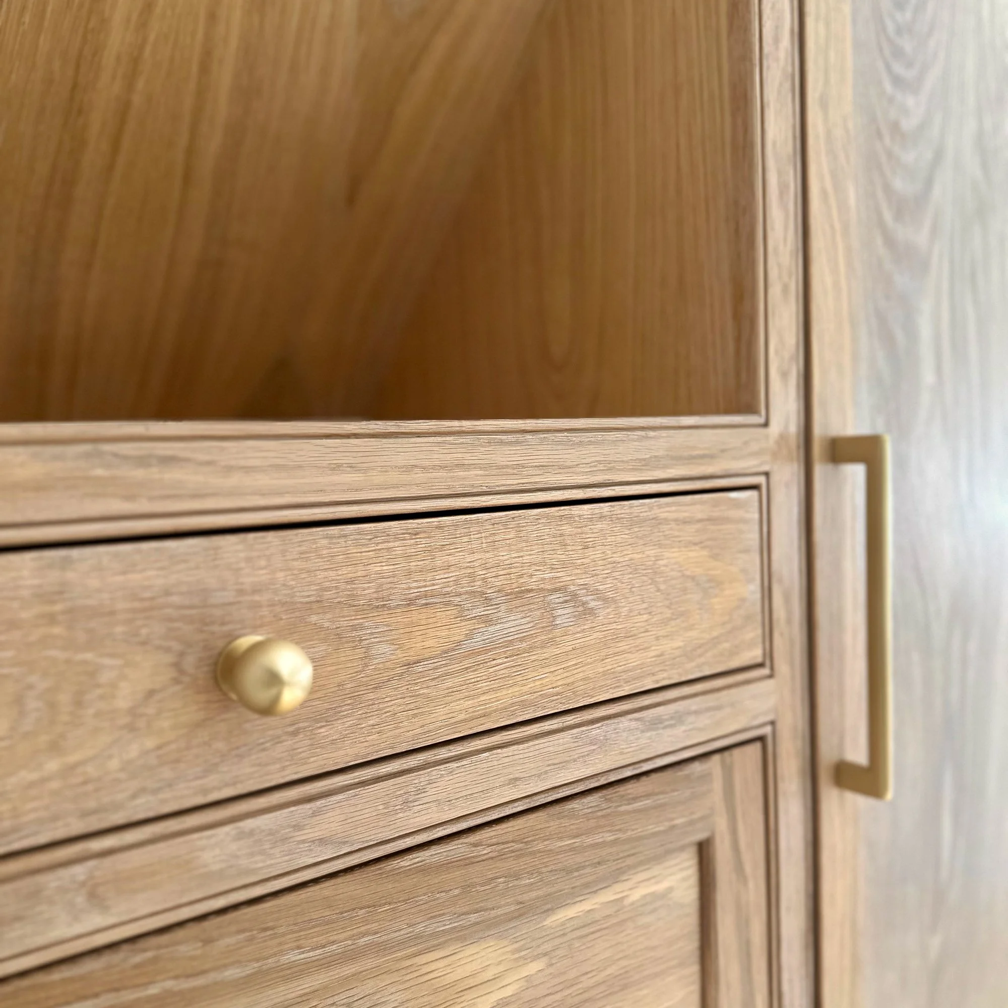 Jewelry drawer | Custom white oak bedroom armoires designed to expand closet storage in a Newburyport, Massachusetts home.