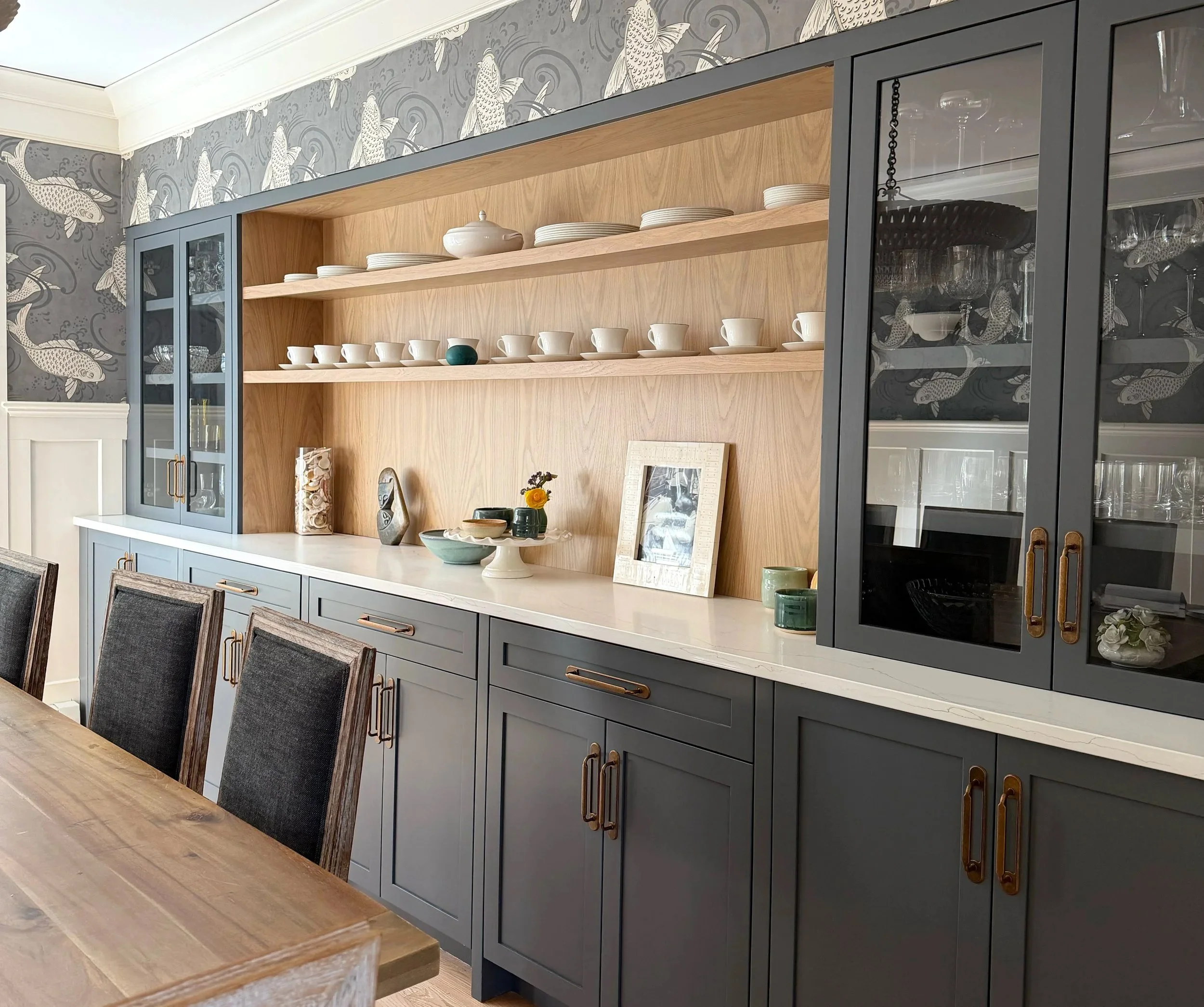 Custom dining room built-in with integrated storage, display shelving, and serving area in Newburyport, Massachusetts.