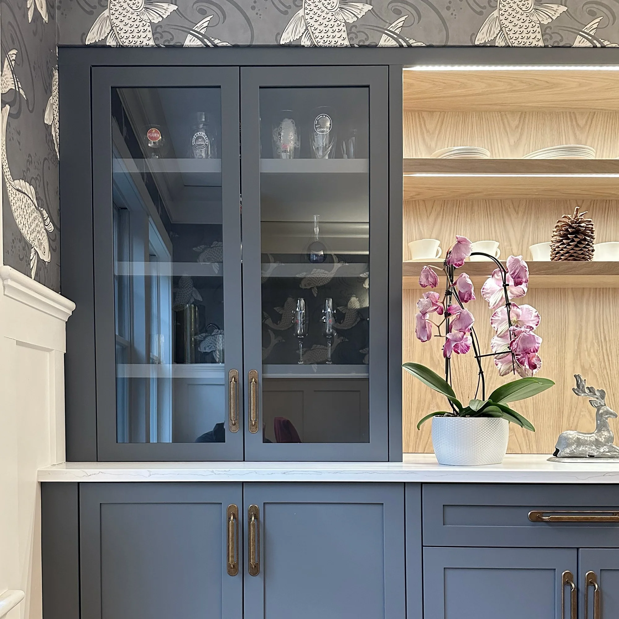 Custom dining room built-in with integrated storage, display shelving, and serving area in Newburyport, Massachusetts.