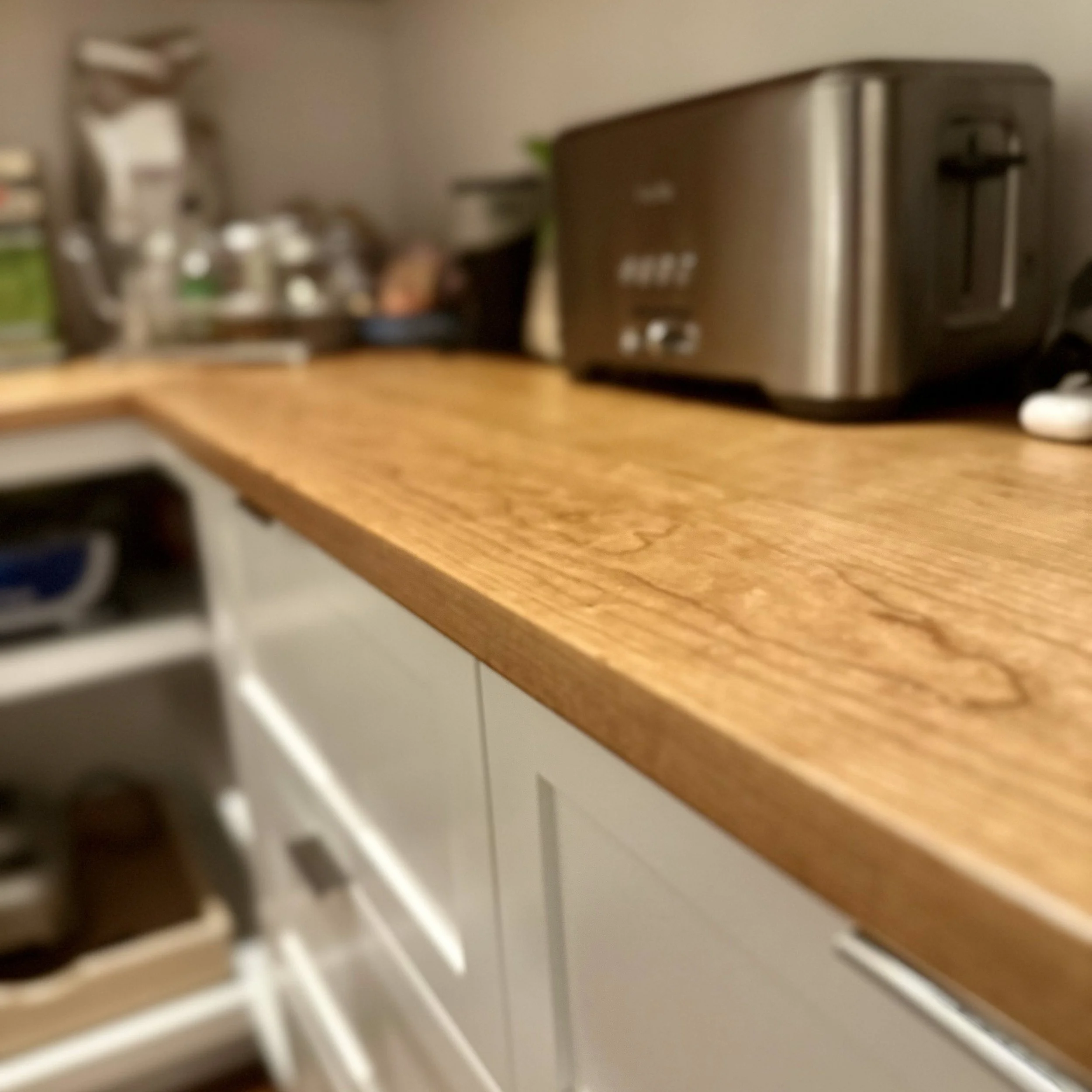Custom pantry featuring cherry countertops and open shelving in a Newburyport home.