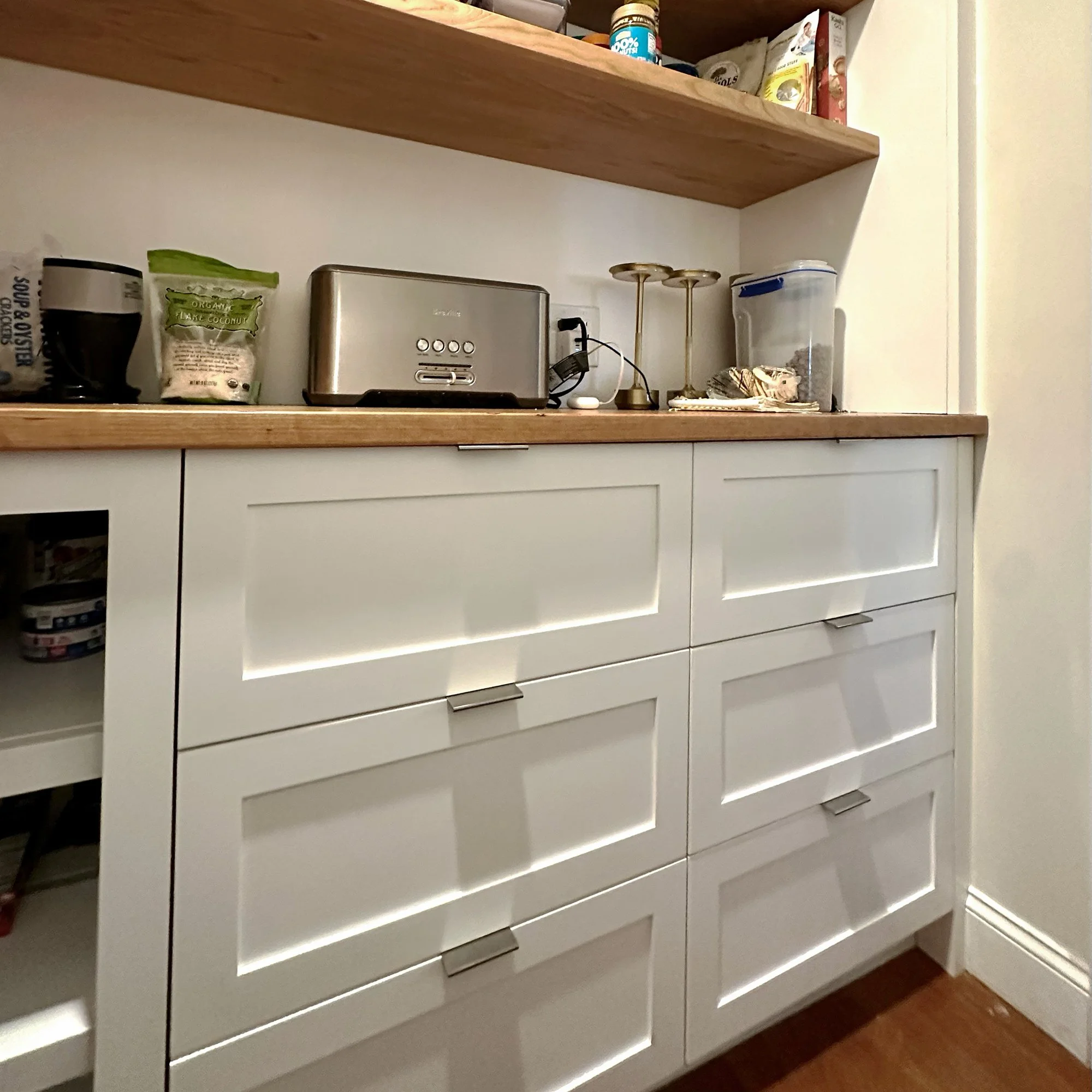 Detail of custom pantry cabinetry and storage solutions in Newburyport, Massachusetts.