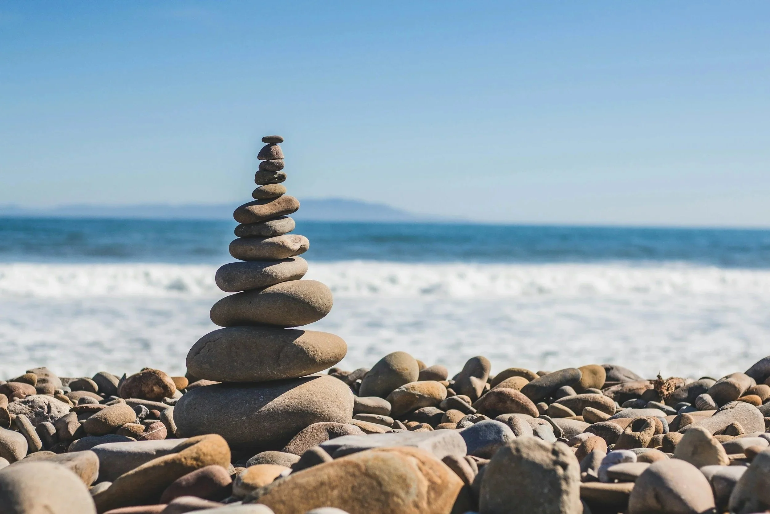 balancing rocks by water