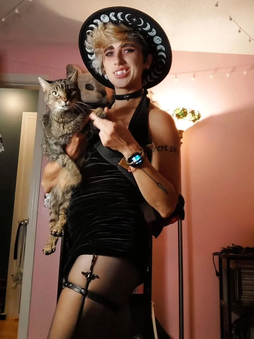 Annual reminder that I am indeed a person who wears people skin and that I am very capable of holding hands with cats