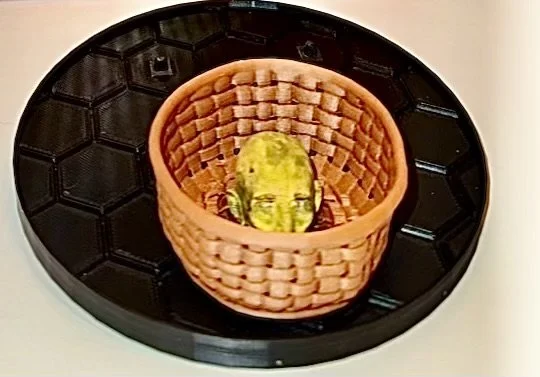 Action figure stand with decapitated head in basket