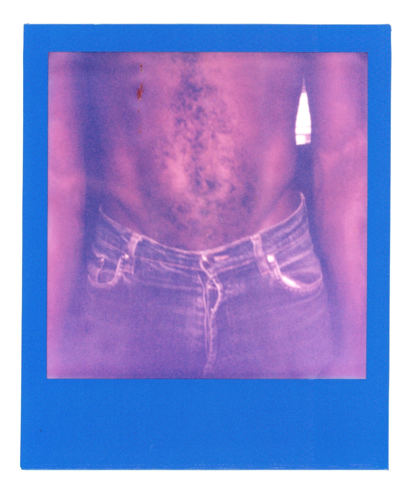 A photo of a person's midsection wearing jeans with a rotary phone in the pocket, in a purple-tinted style.