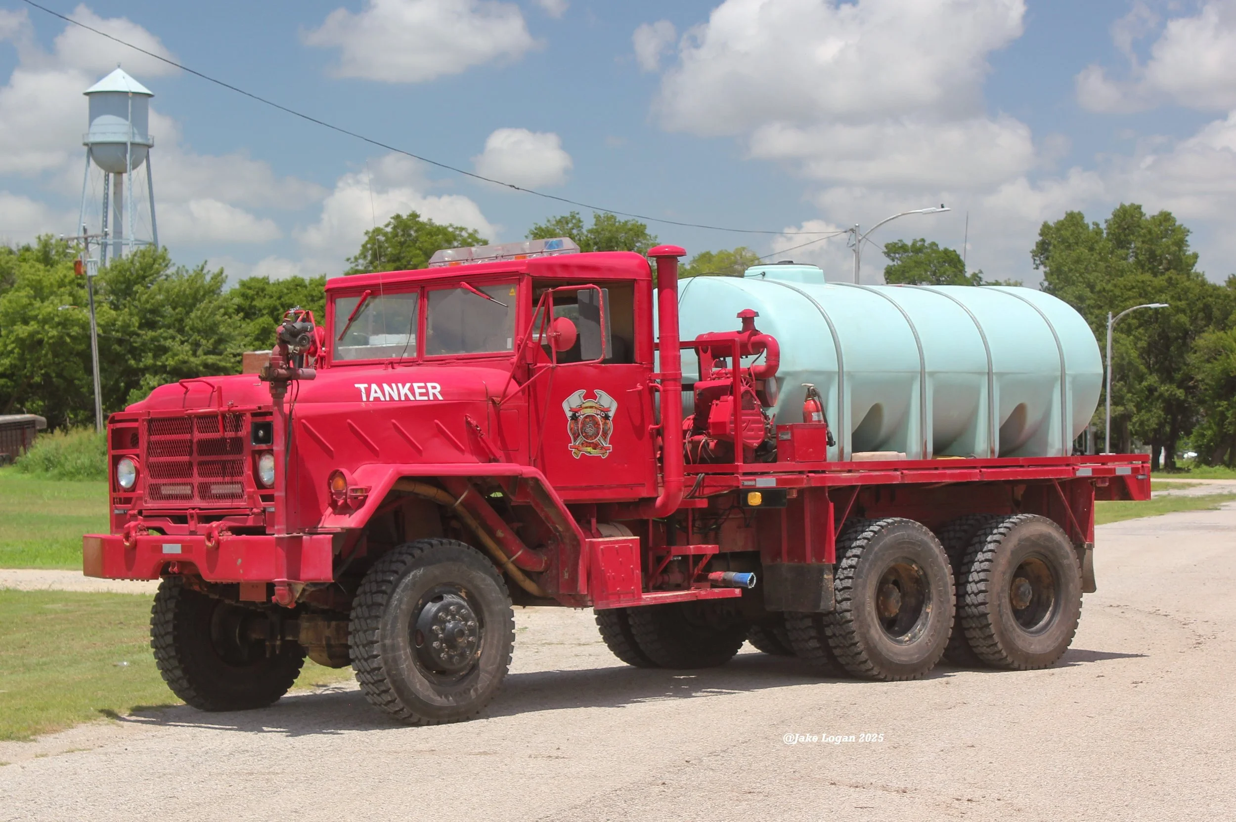 Tanker 58 - 1997 AM General/MFD - 200 Barnes/1500 Tank - Diesel/Auto - ex-Medford, OK
 
 
The newest overall addition to the department, Tanker 58 is the first out tanker for the department, but can also be used as a heavy brush pumper if needed. Thi
