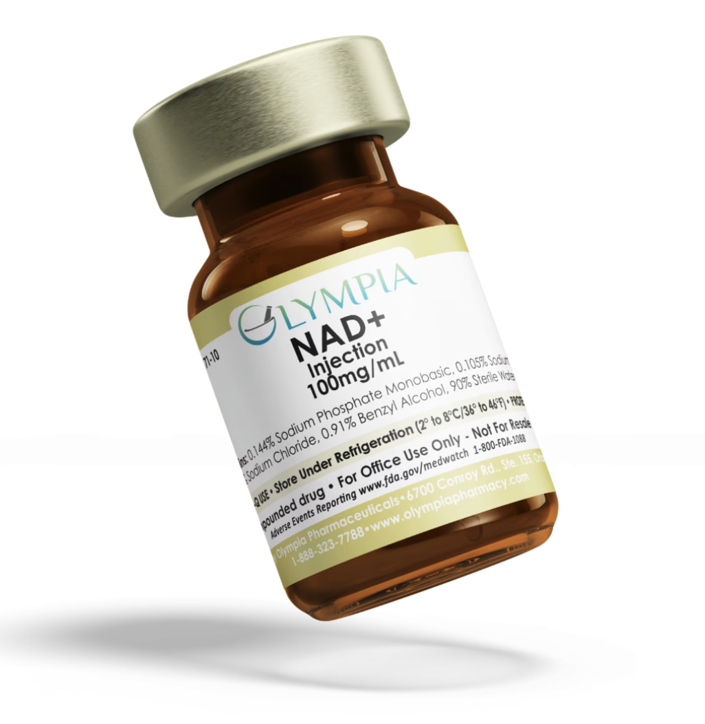 A small glass vial labeled NAD+ with a silver cap, containing a yellowish liquid, placed on a white surface