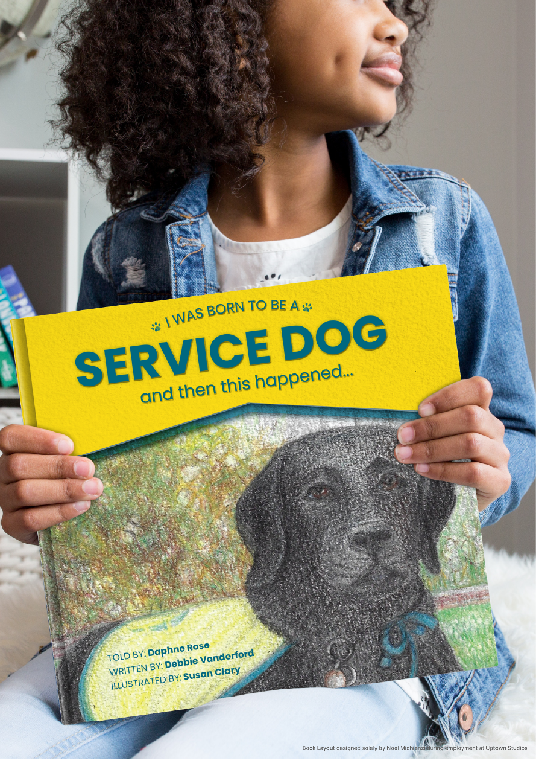 A girl holding a book titled 'I Was Born to Be a Service Dog and Then This Happened...' featuring an illustration of a service dog with a background of trees.