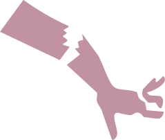 A hand holding a broken purple or mauve paper plane.