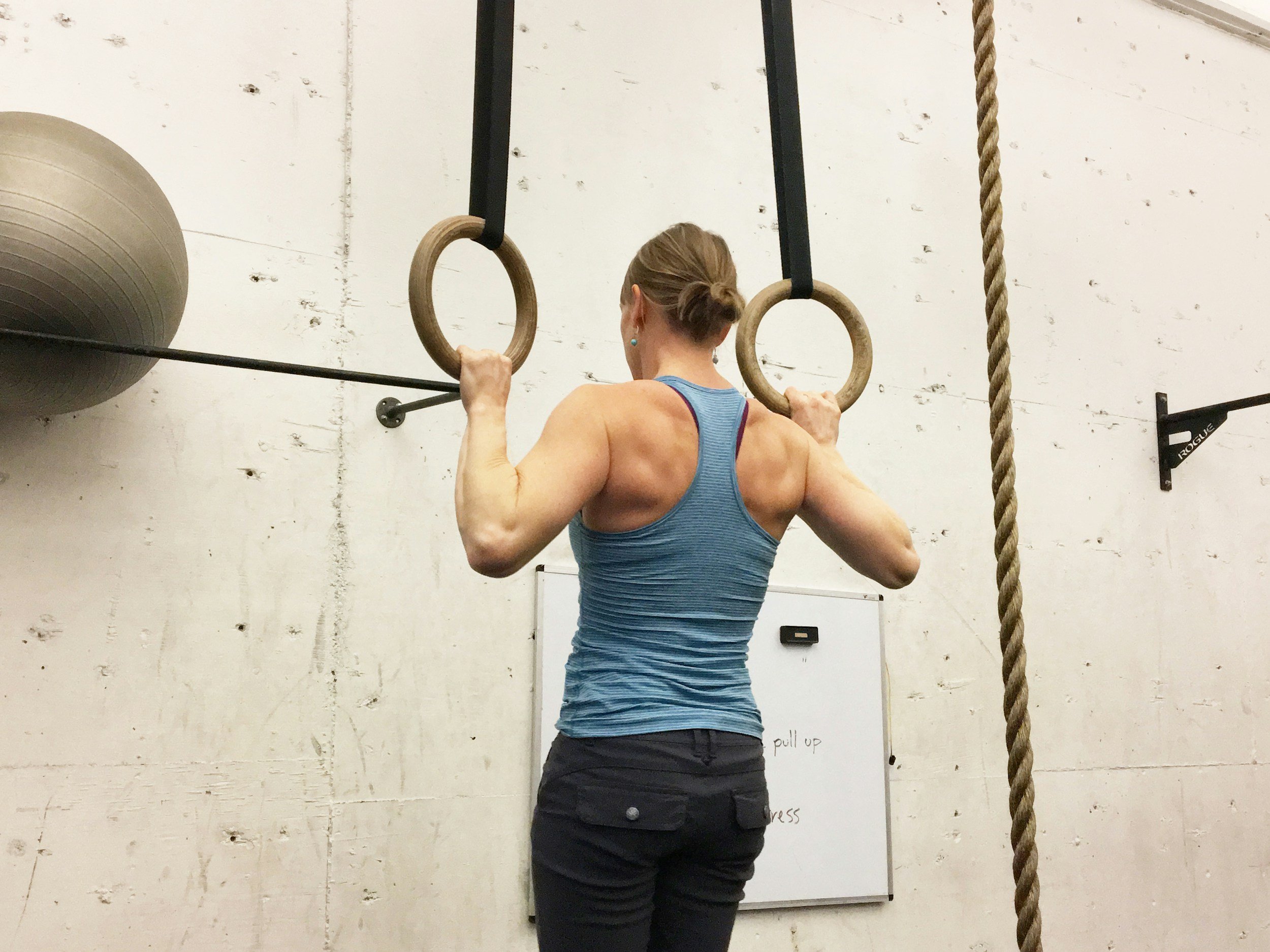 an athletic person doing workout using shoulders and upper body and back strength straining
