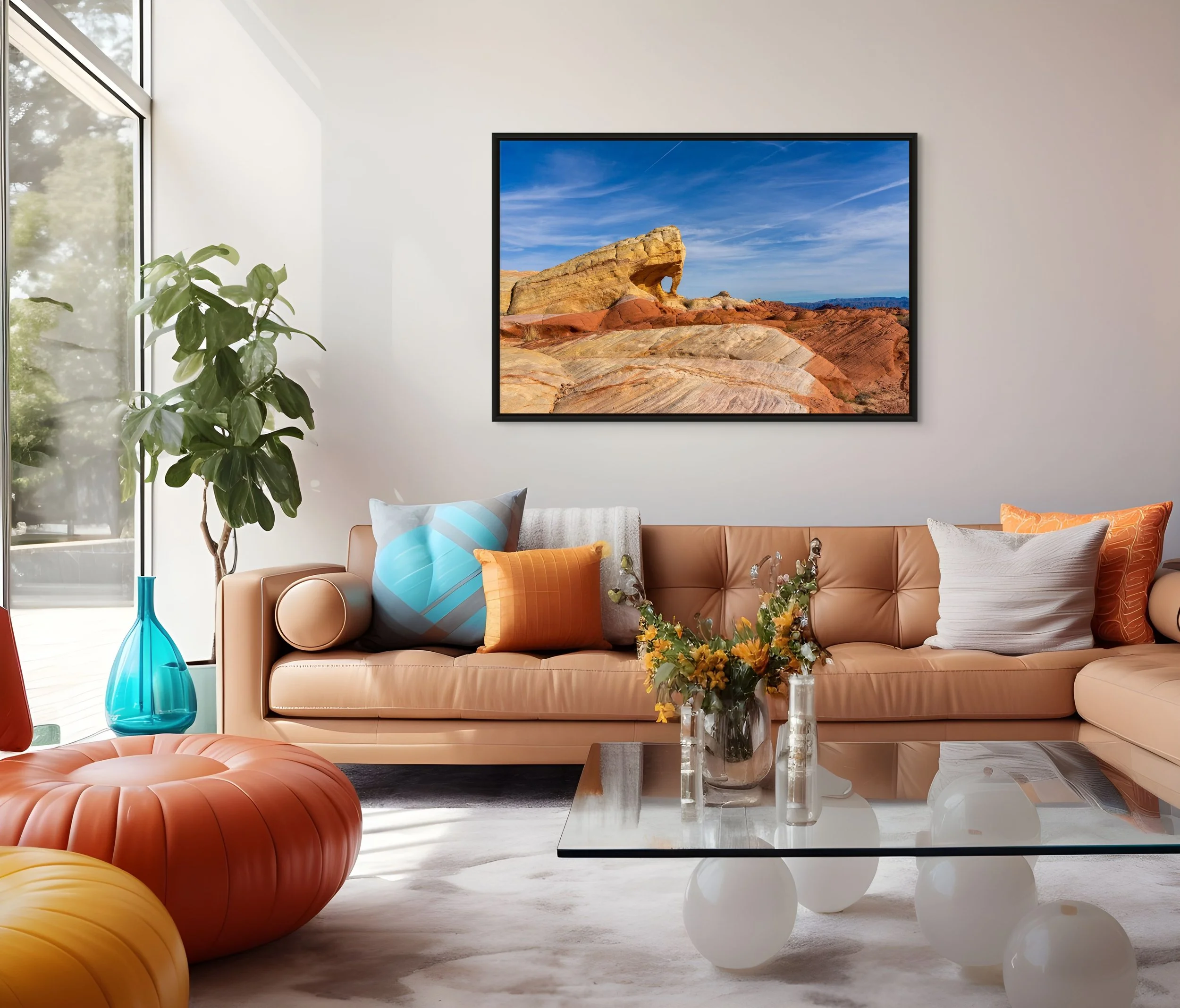 The Unmapped Eye in a floating Black frame above a modern sofa with colorful pillows and an orange ottoman.