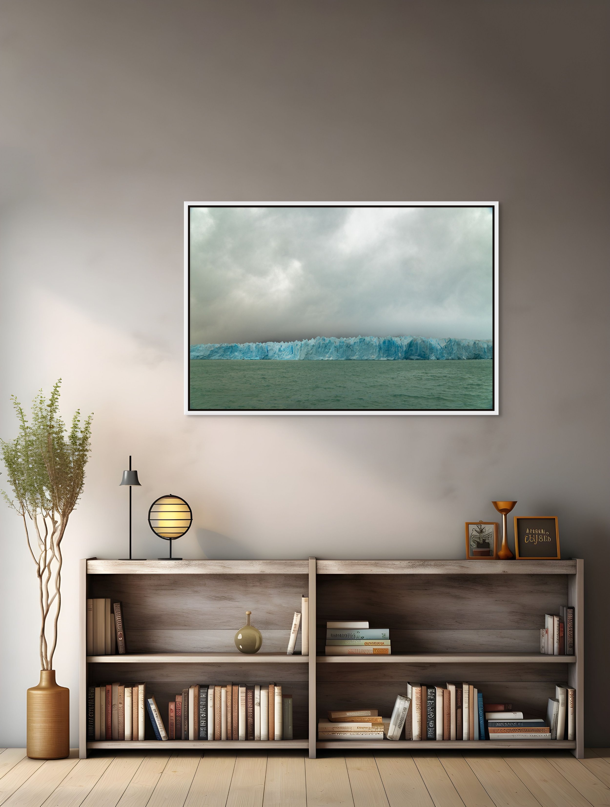 Ice Holds Memory in a floating White frame, over a light console with vase and plant in a softly lit living space.