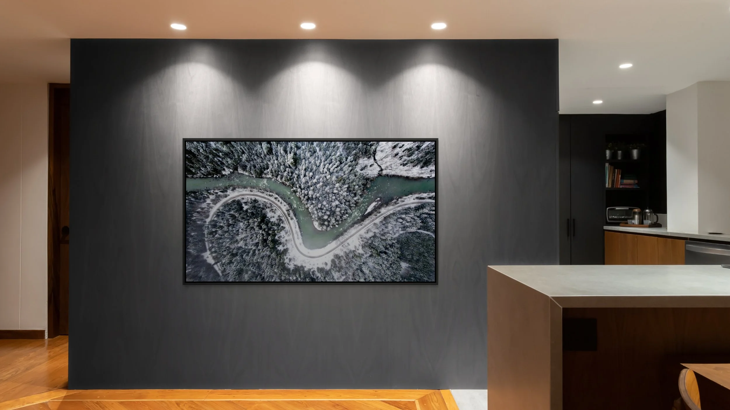 The Hidden Curve, floating Black frame, mounted on a dark gallery wall under ceiling spotlights.