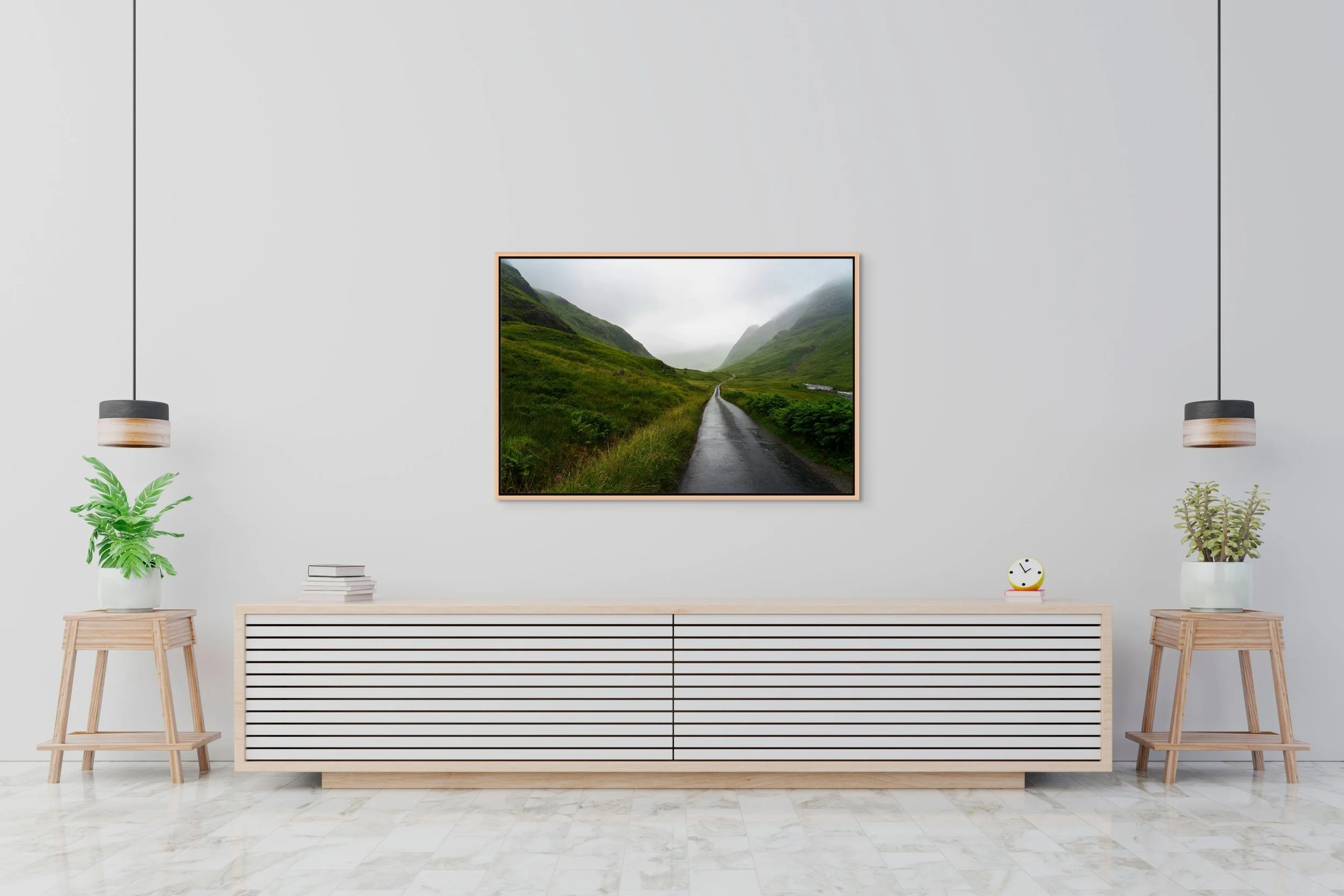 Into the Mist, framed in a natural oak floating frame, hanging above a low white sideboard in a clean, minimalist interior.