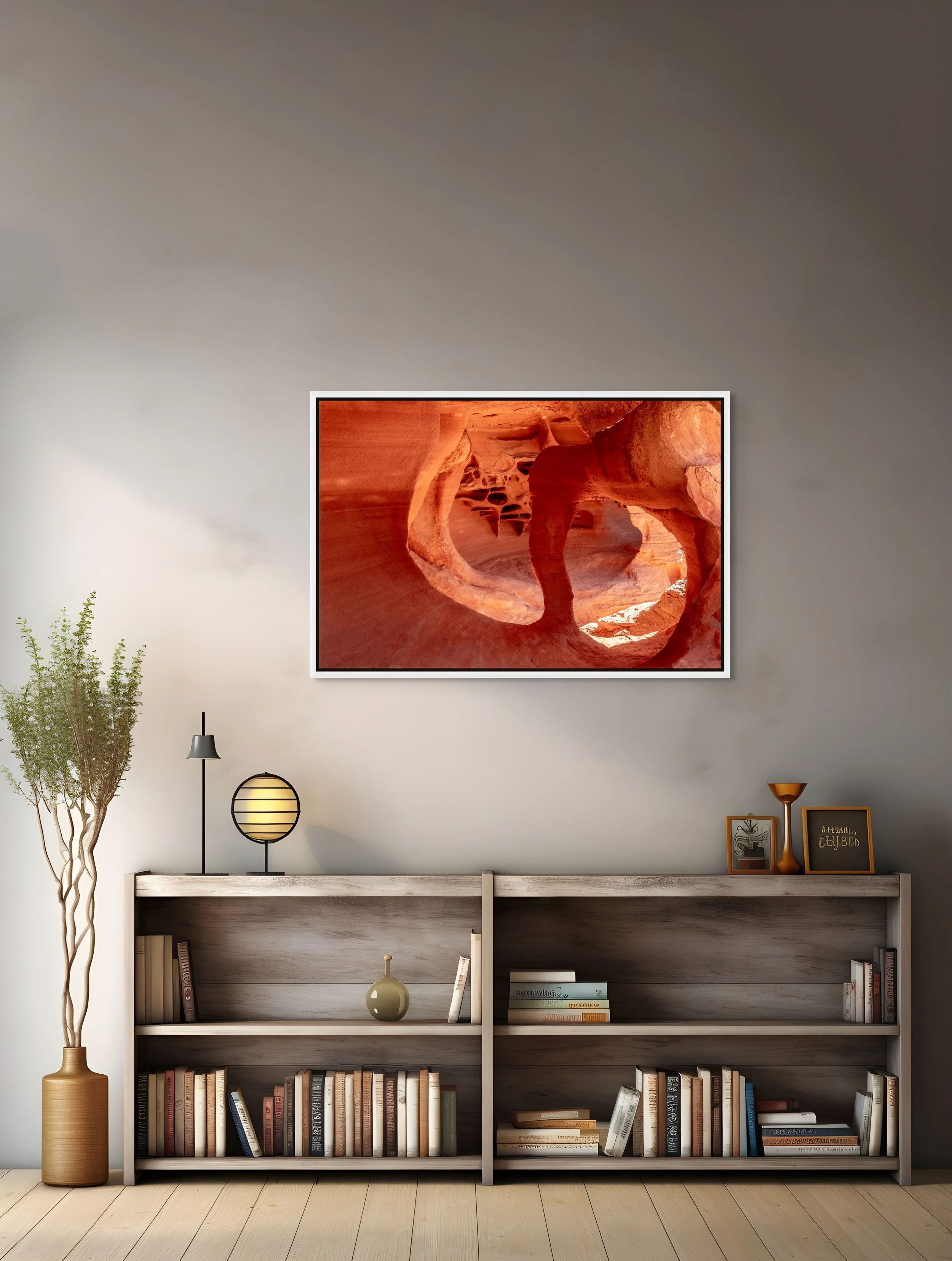 Cathedral of Stone in a floating White frame mounted on a textured grey wall above a styled bookshelf.