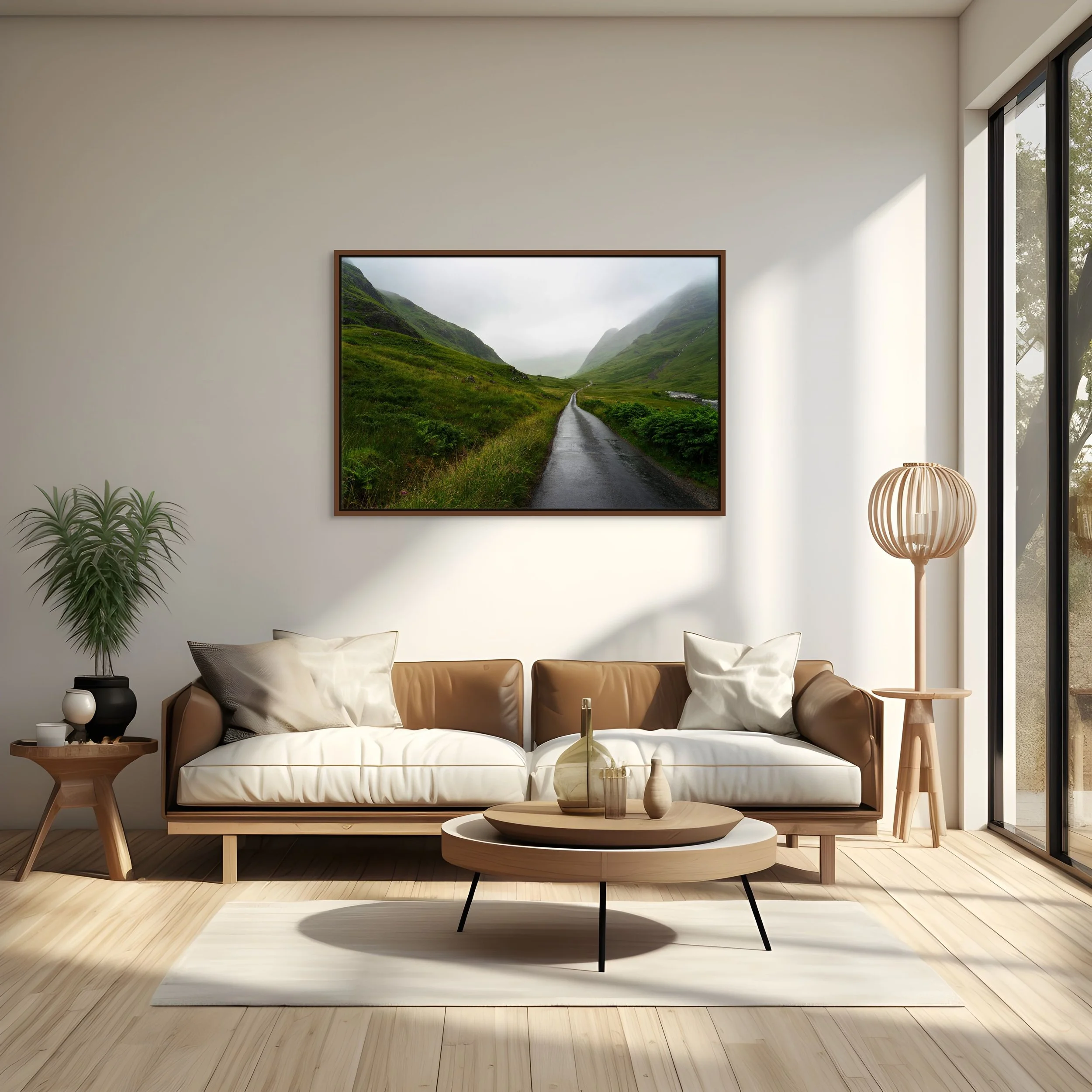 Into the Mist, framed in an alder brown floating frame, styled above a tan sofa in a bright living room with tall window and floor lamp.