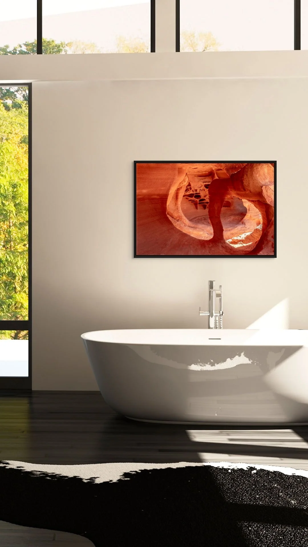 Cathedral of Stone in a floating Black frame above a freestanding tub in a bright bathroom with a large window.