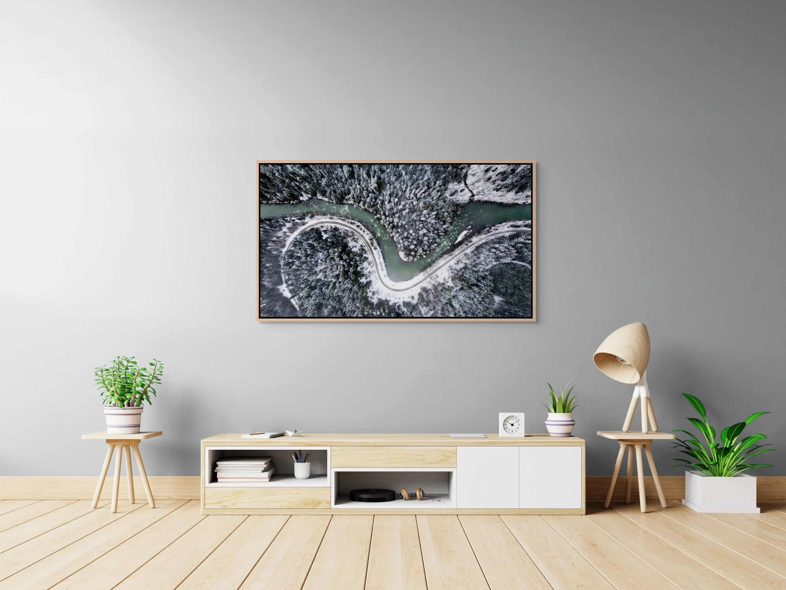 The Hidden Curve, floating Natural Oak frame, displayed in a clean home-office setting with desk and soft daylight.