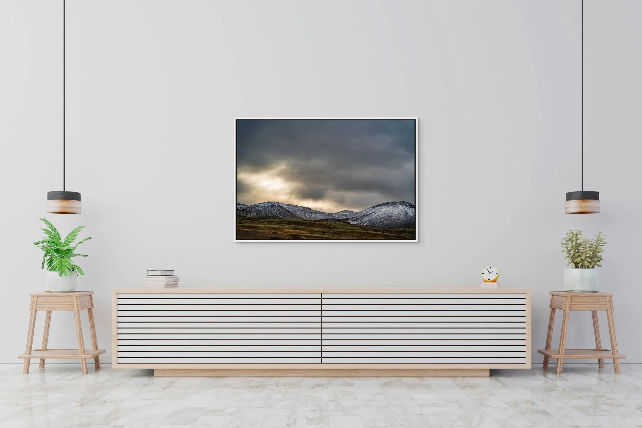 Snow, Then Silence in a floating White frame, centered above a minimalist white sideboard with small plants.