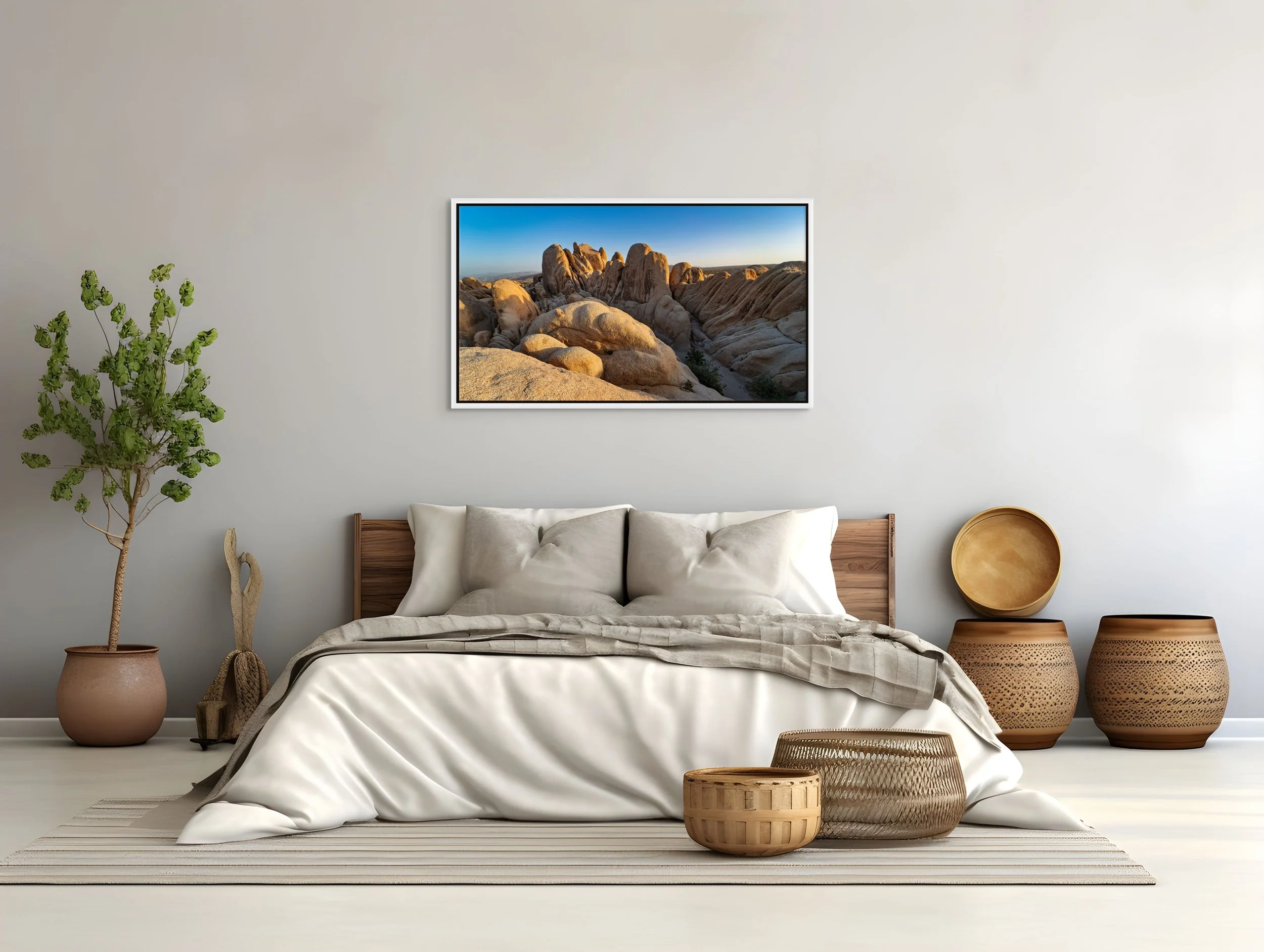 Stone Waves — sculpted granite ridges at sunrise; white floating wood frame over a neutral bedroom with a textured plaster wall.