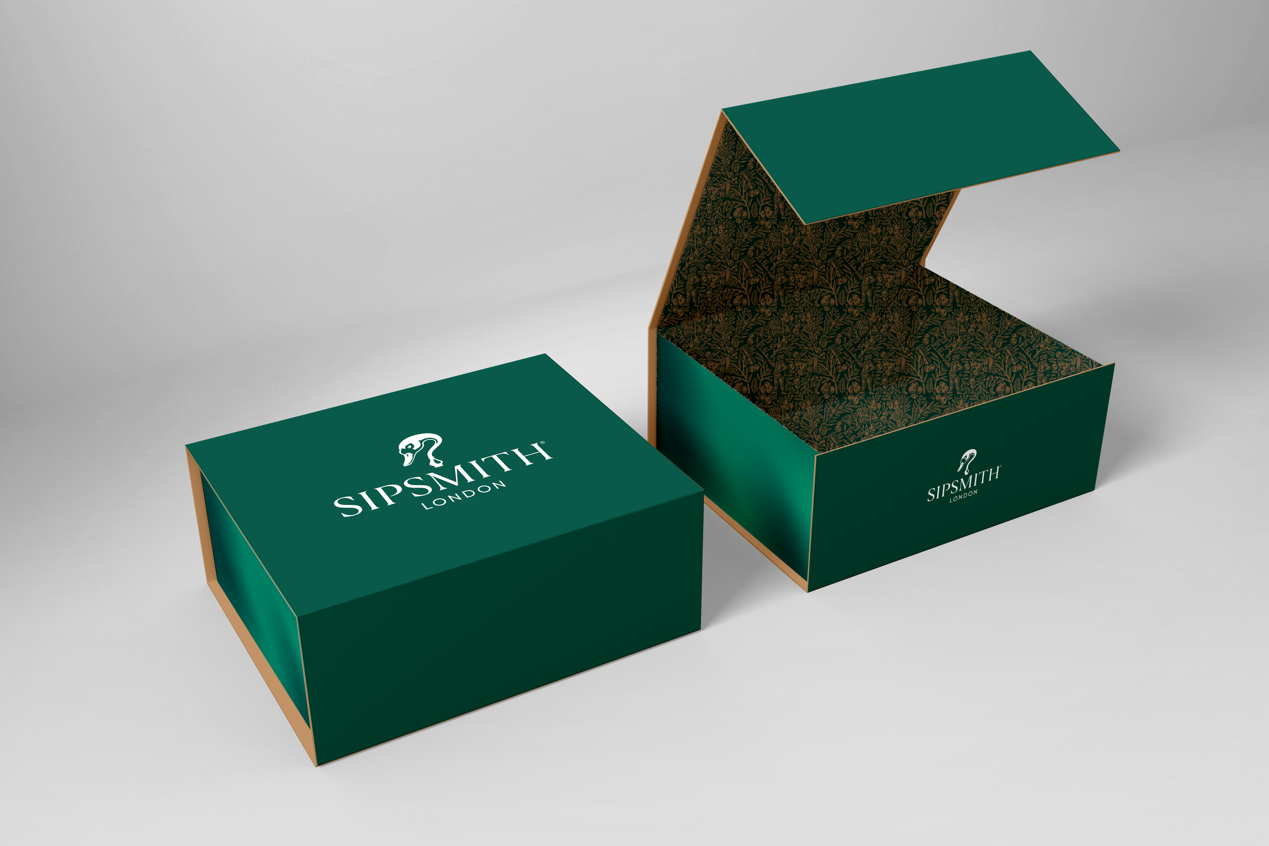 Open green box with Sipsmith London logo, showing decorative interior pattern.