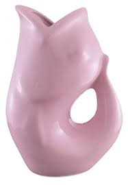 The GurglePot beverage pitcher provides a delightful “gurgling” sound as trapped air is released from the tail after pouring. Crafted of durable stoneware. Versatile as a drinks dispenser or vase.