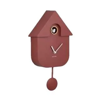 A modern wall clock designed like a house with a pendulum, in a brownish color.