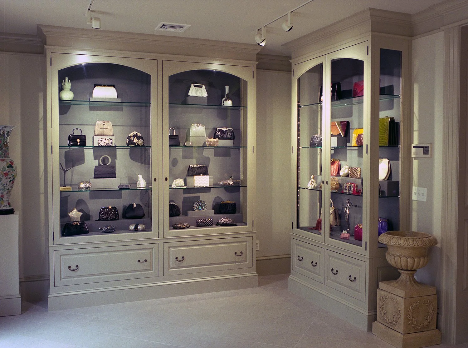 Display of dazzling Judith Leiber handbags in glass cabinets in The Leiber Collection museum.