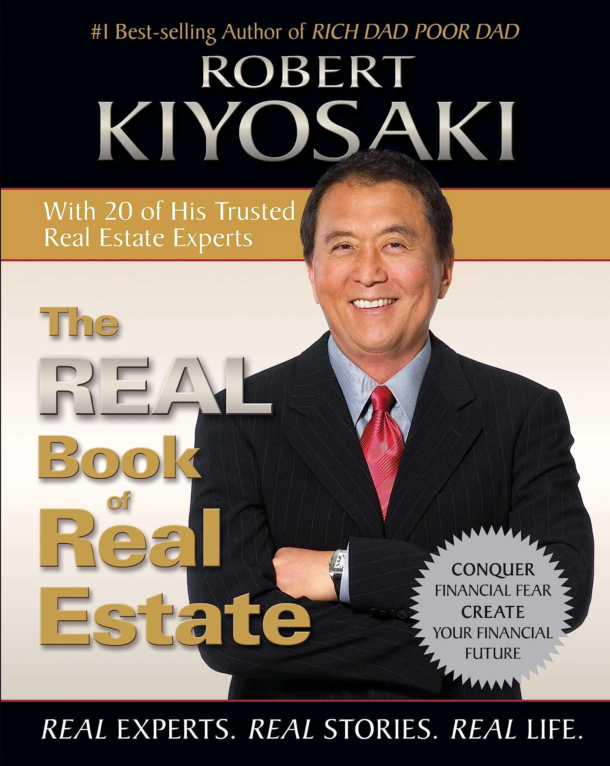 Book cover for 'The Real Book of Real Estate' by Robert Kiyosaki, featuring a smiling man in a dark suit with a red tie, holding his arms crossed. The cover contains text about real estate, financial fears, and financial future, with gold, silver, bl