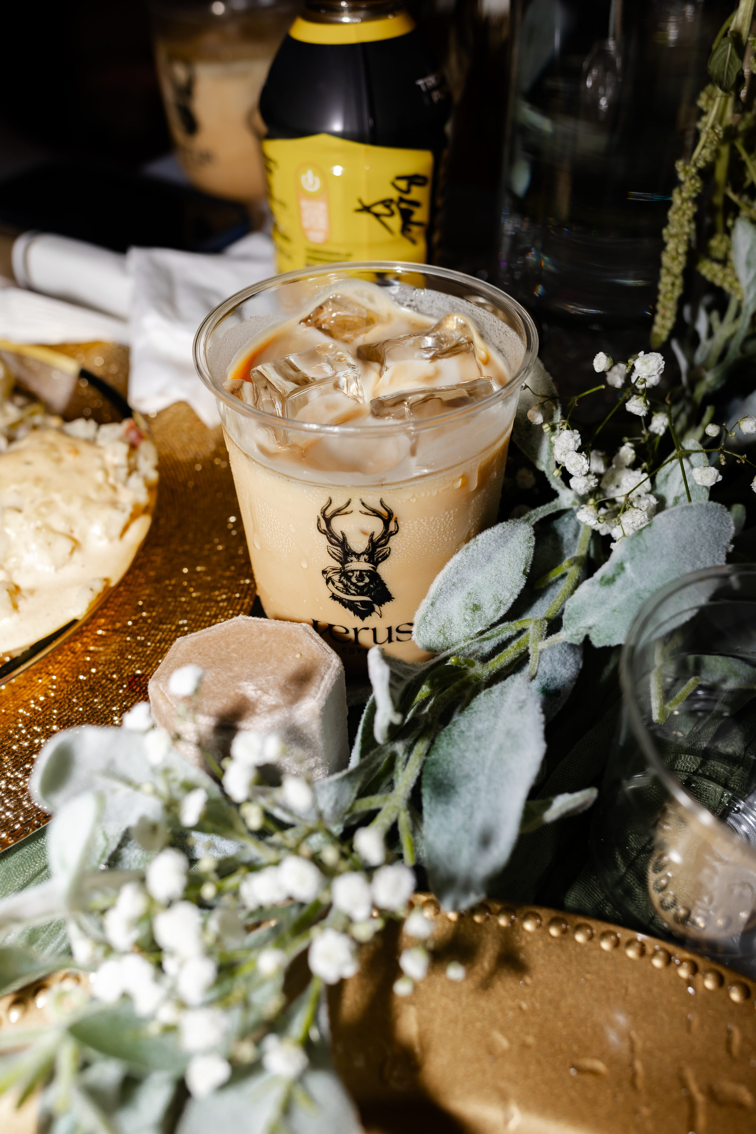 Verus iced coffee served beside flowers at a wedding