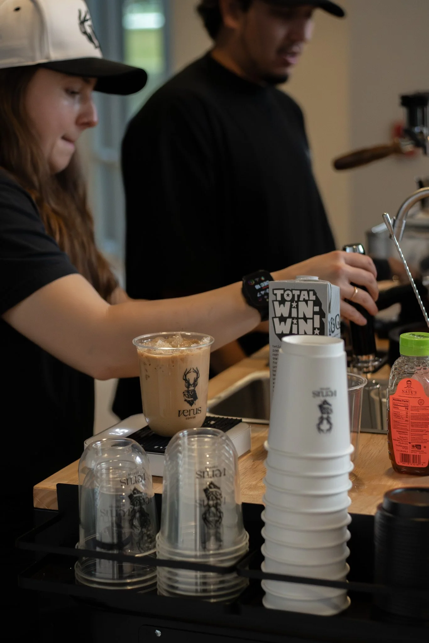 Close up of chef straining hand made syrups for coffee