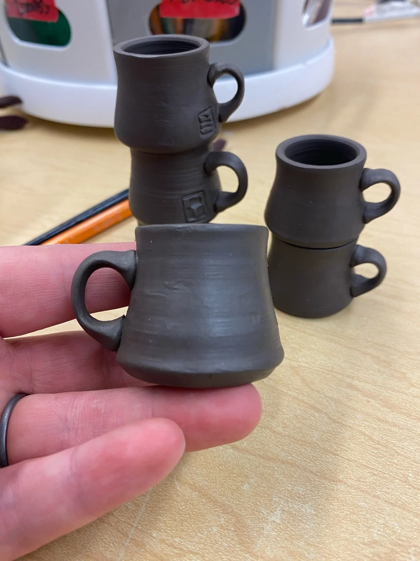 More mini mugs are on the way! I&rsquo;m using @kentuckymudworks Brown Bear clay and it throws like a dream. These mini handles are so cute I can&rsquo;t stand it. Excited to see the glazes on these!! Dark clays always make the glazes extra special #