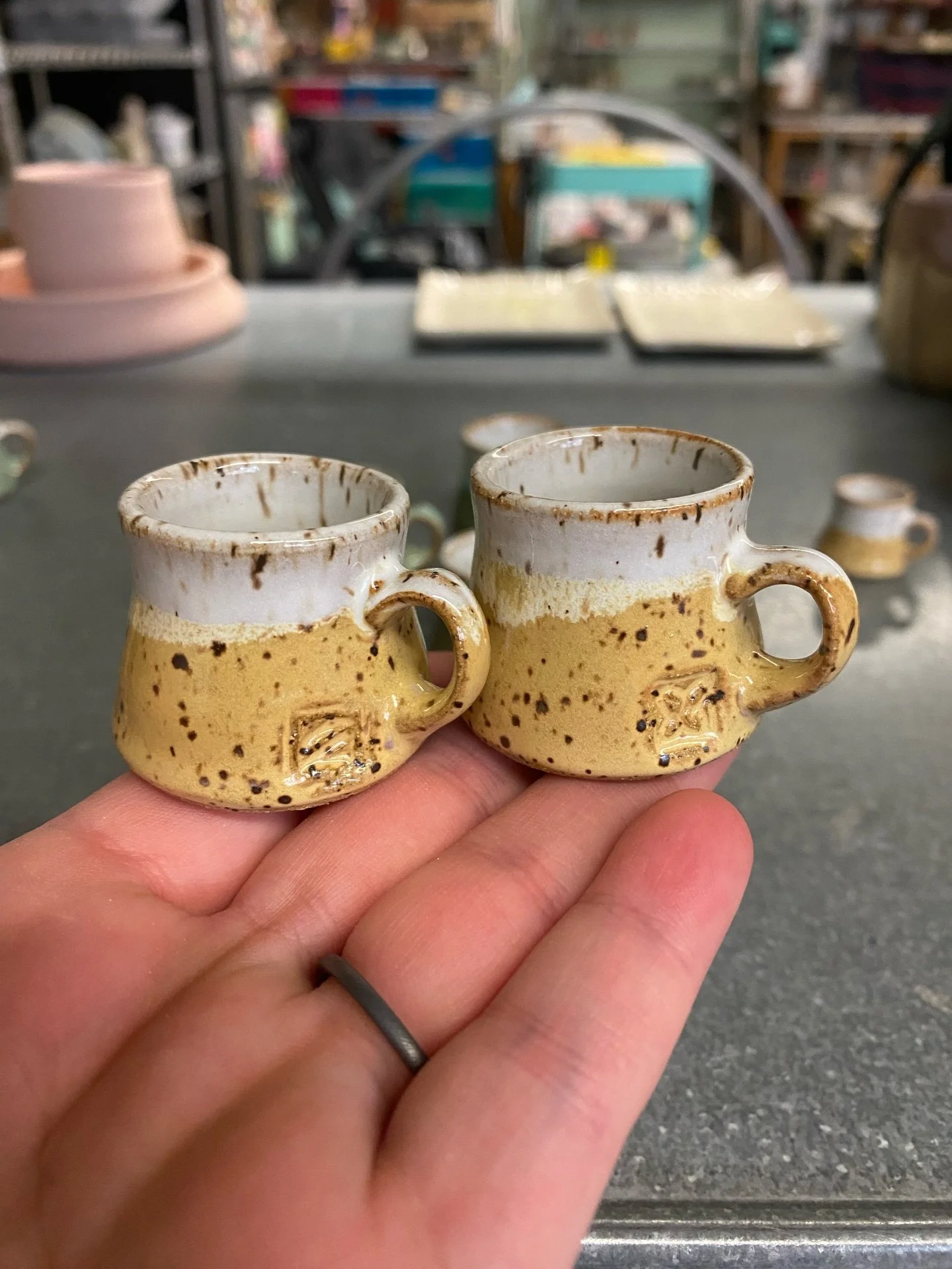 Mini mugs! Complete with one of my regular glaze combos and a side stamp. The handles are soooo tiny, but actually not as hard to make as I imagined. I throw the mug bodies on my mini wheel, make the tiny handle, stamp with a tiny stamp and off they 