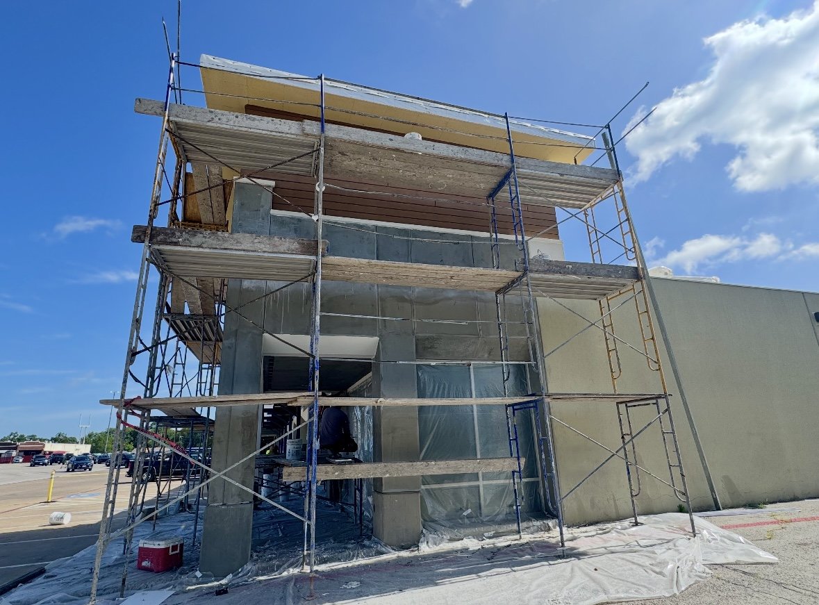 Stucco restoration on retail strip center in Dallas
