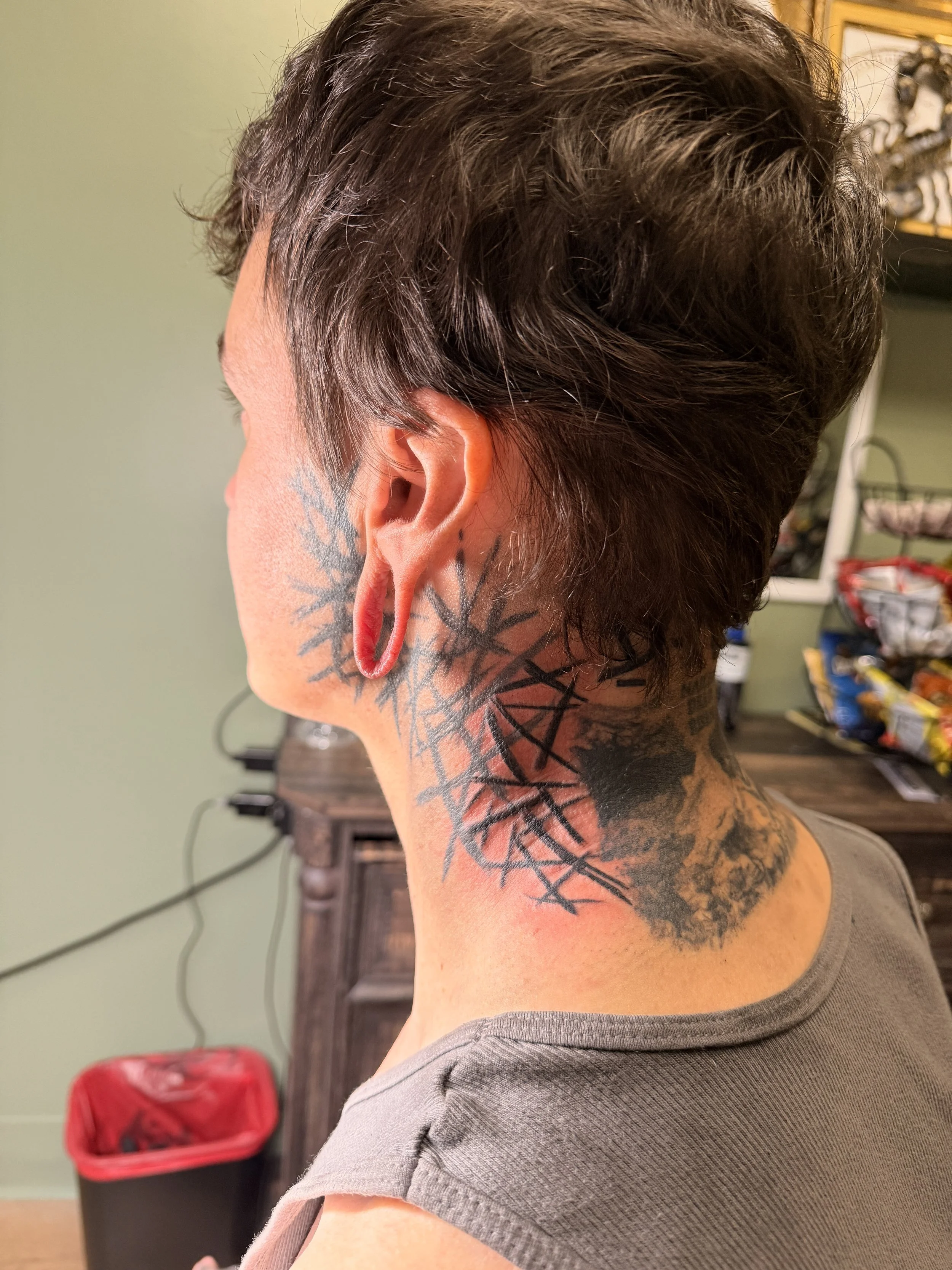The skull cave at the back of the neck is my healed work and he retuned to add some brush lines to fill the space