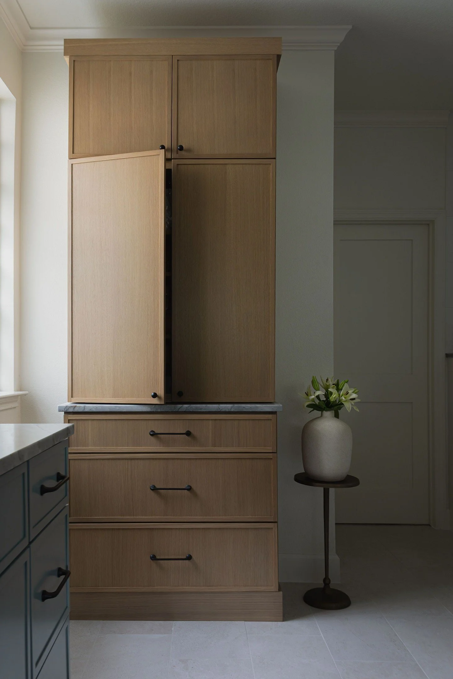 Bathroom linen storage doesn't have to be a walled-in closet. In this renovation, we removed the traditional linen closet and replaced it with a custom built-in cabinet. Same storage capacity, but with a more intentional footprint and a furniture-lik