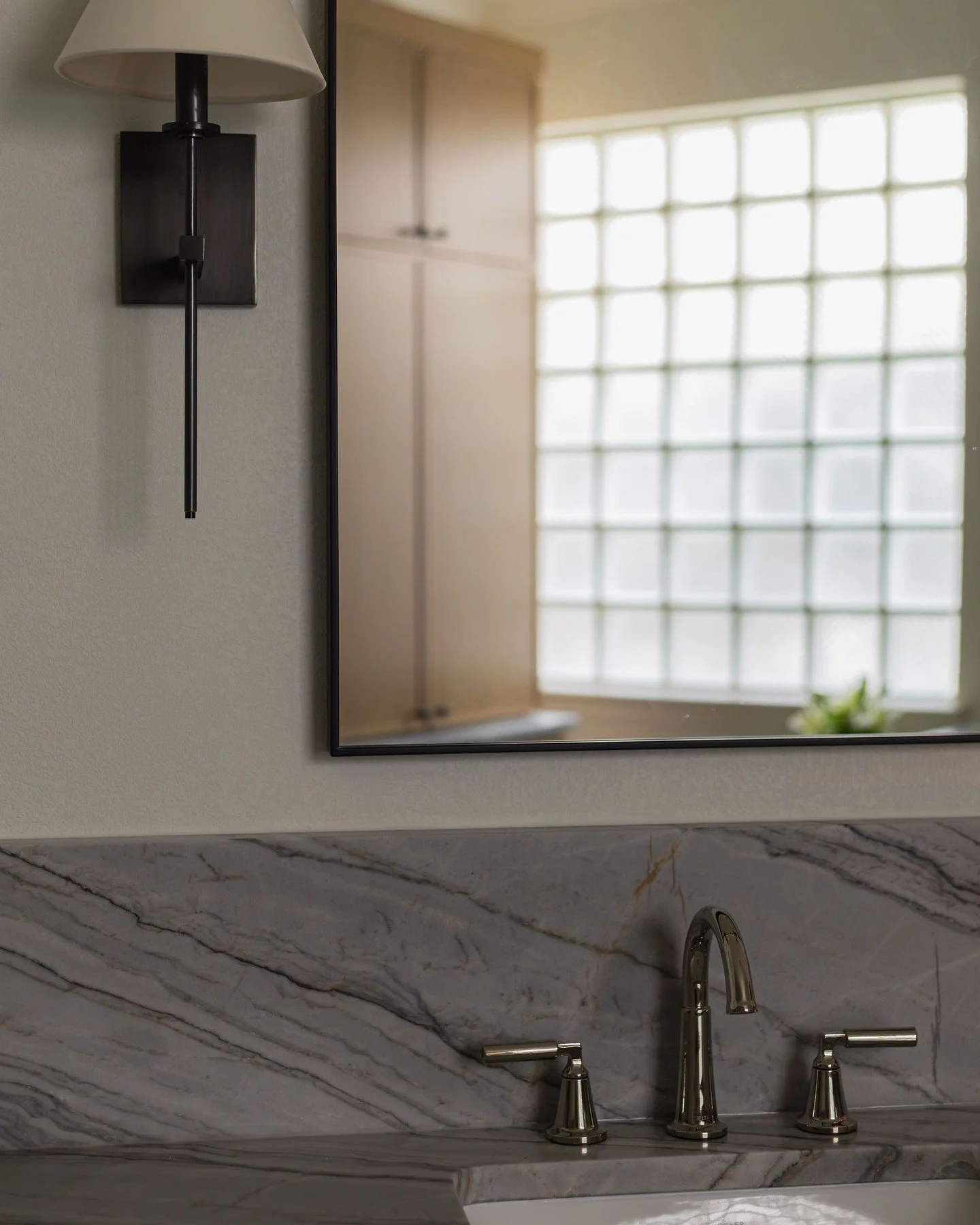 Polished nickel + matte black: my current favorite metal combo.

Polished nickel brings a clean and classic look, while black adds contrast and a little edge. The result feels sophisticated but not stuffy. 

Would you mix finishes in your bath, or ar
