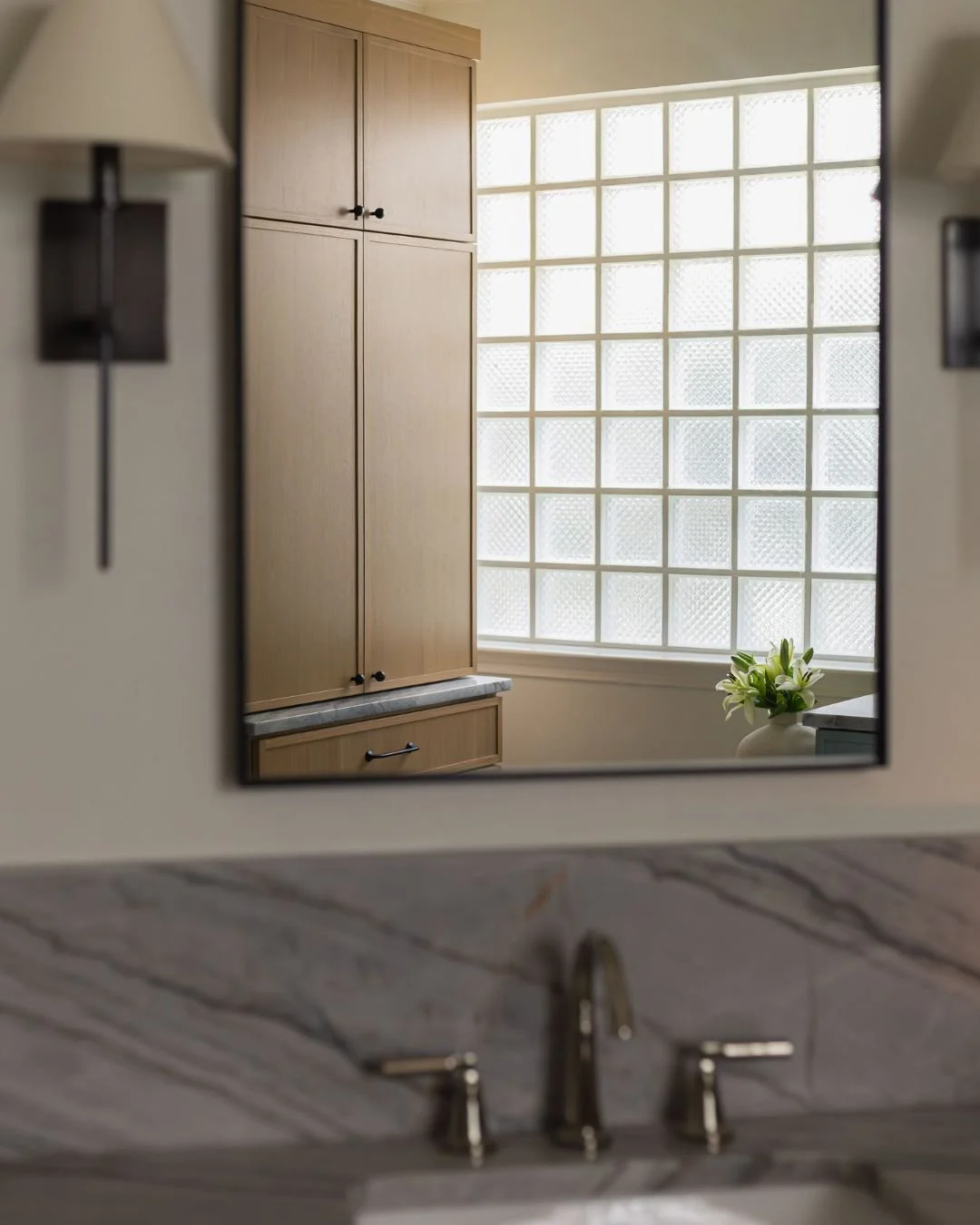 Glass block gets a bad rap. But in this primary bathroom remodel, we kept it &mdash; and it ended up being one of my favorite decisions in the space.

The soft, diffused light it provides is hard to replicate. It also solves a real problem: privacy w