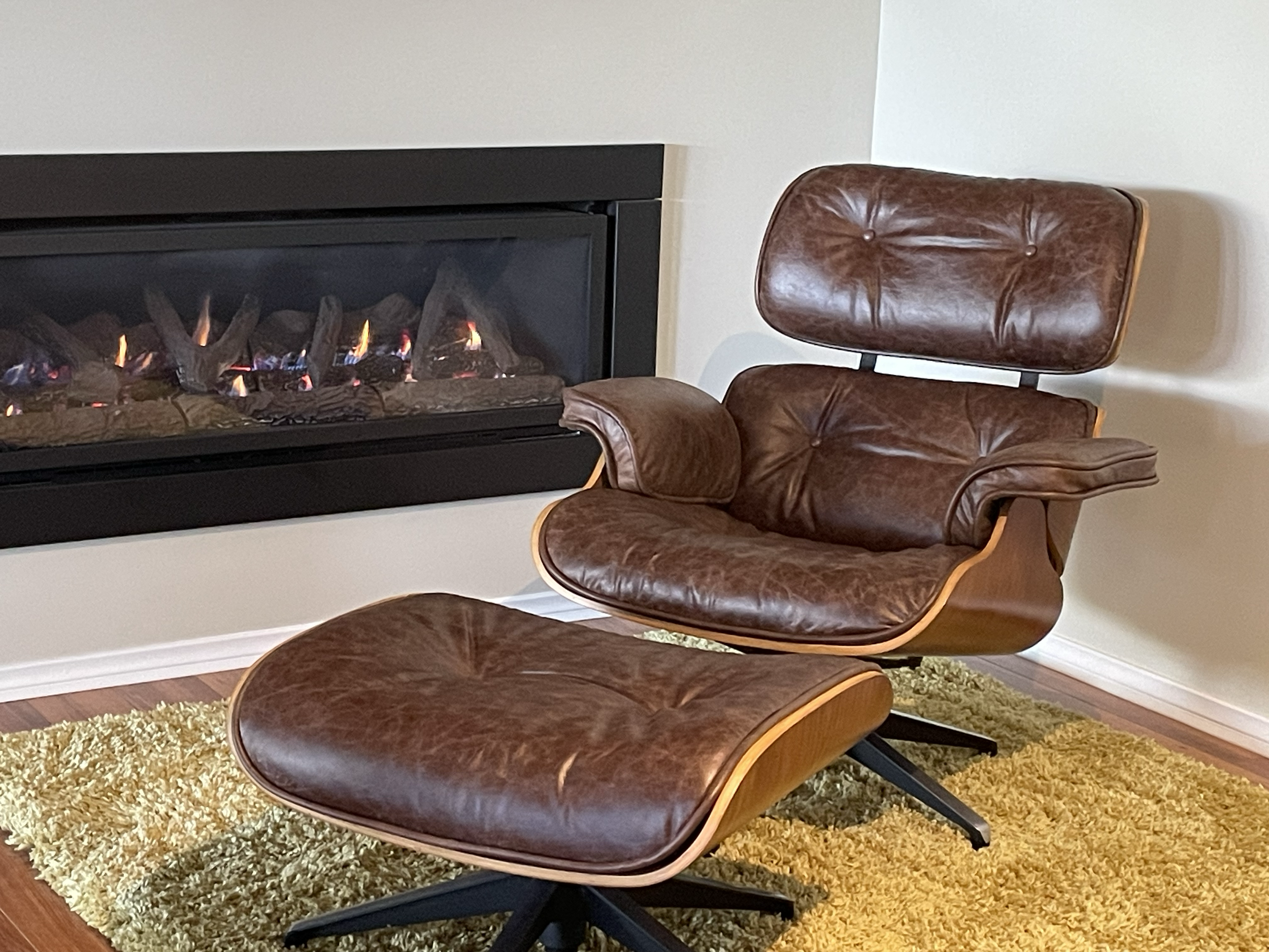 Example of Eames chair recovered in antique brown leather by John of JB's upholstery specialist