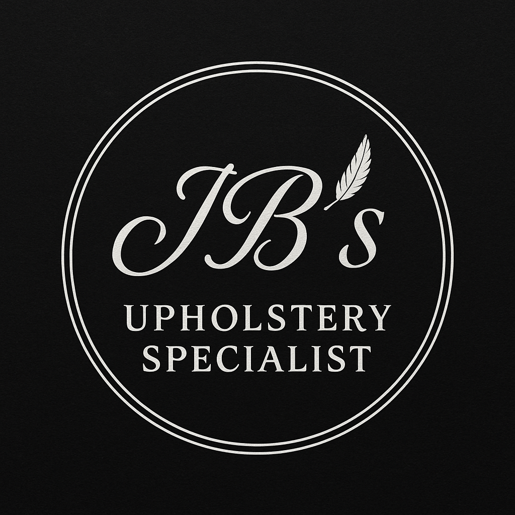 Logo for J.B.'s Upholstery Specialist with white text and feather graphic on black background.
