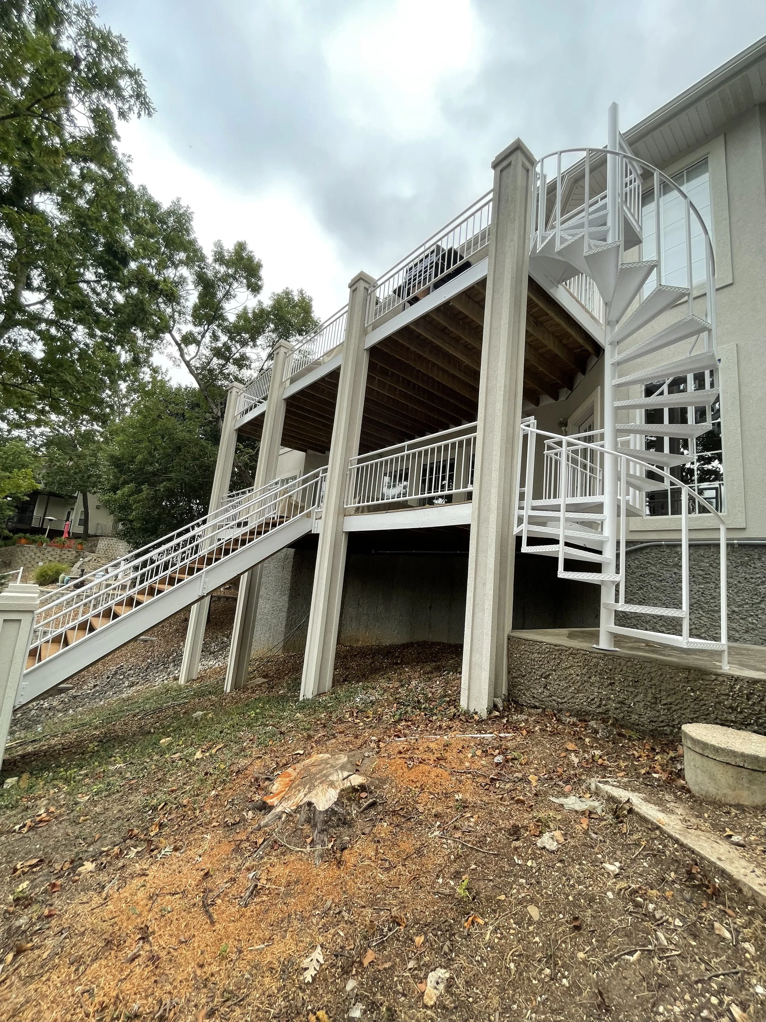 Massive multi-level deck system painted and restored by Quality Control Painting on the Lake of the Ozarks.
