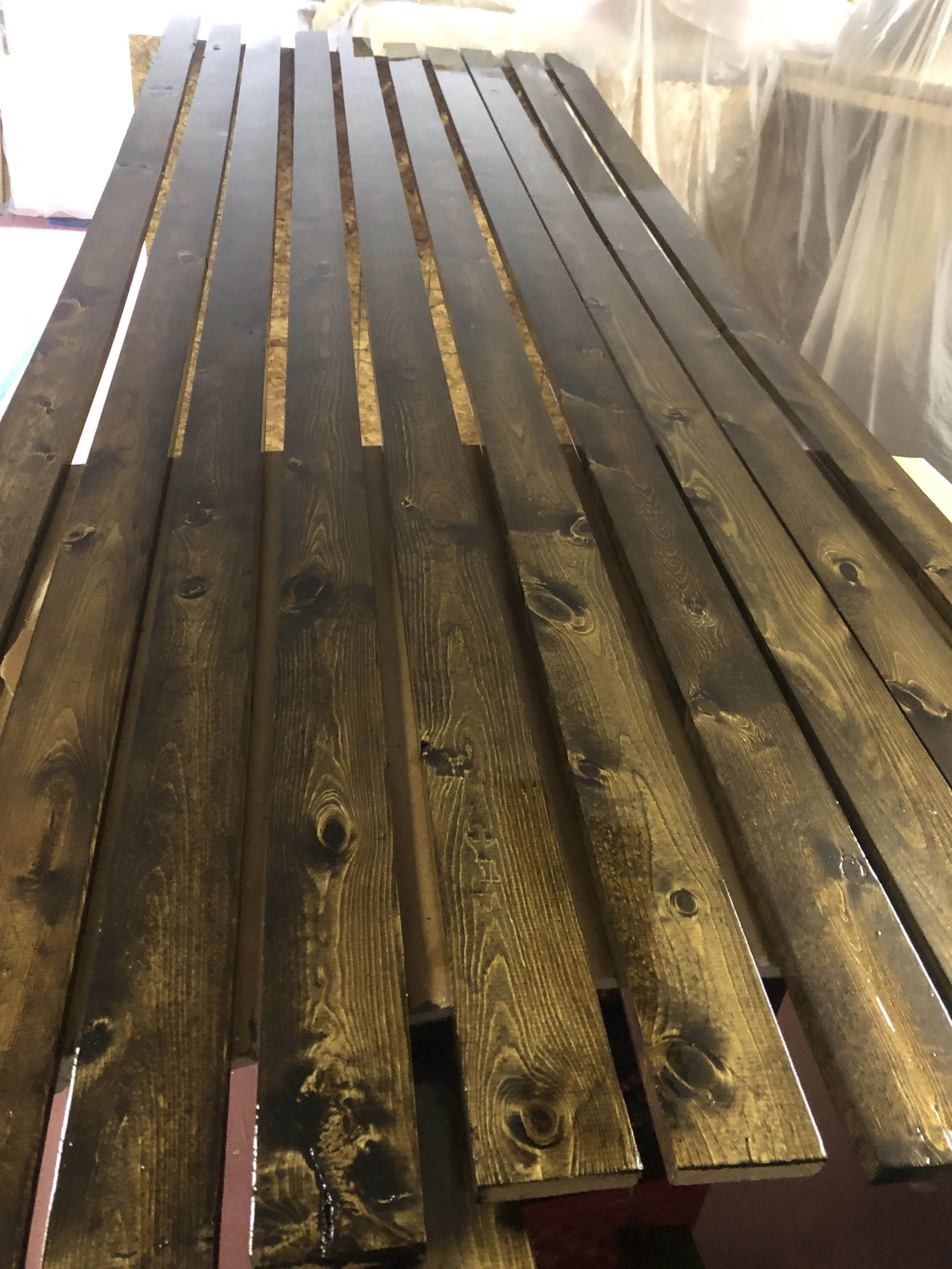 Professional wood staining showcase by Quality Control Painting in the Lake of the Ozarks, featuring a high-end transparent finish on natural cedar decking.