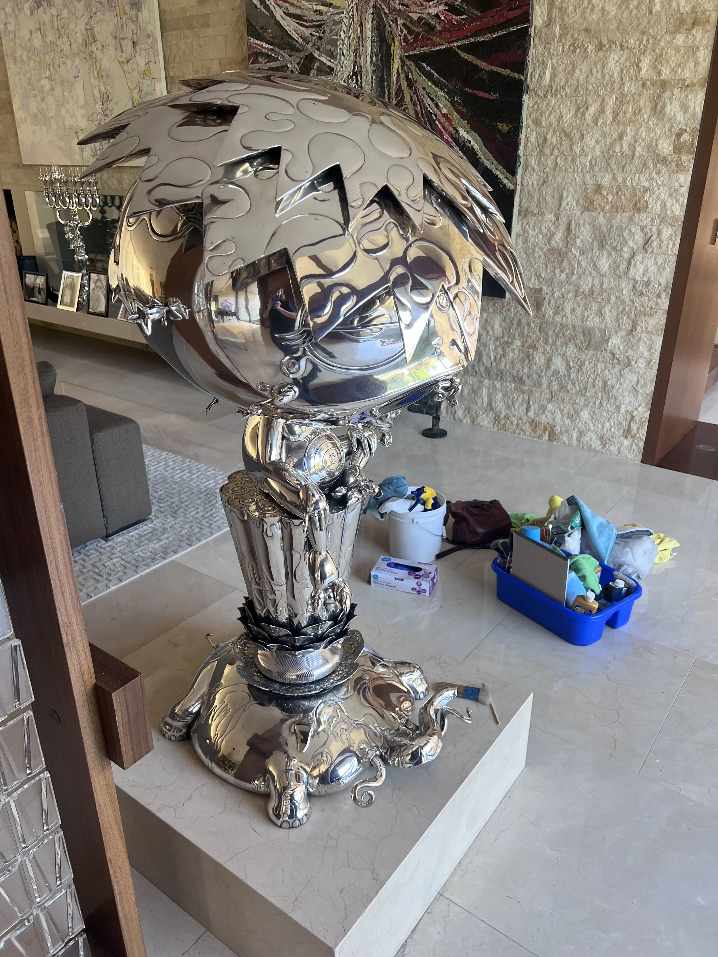 Murakami oval buddha silver sculpture.